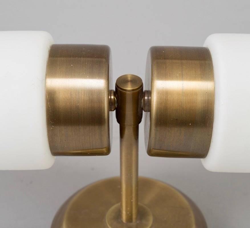 Wall lamp with two-light sources made of brass and opaline glass. Scandinavian maker, circa 1960-1970. Great lamp to use above a mirror.
