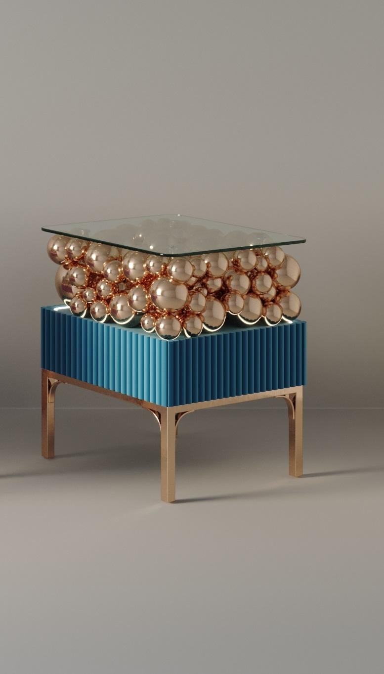 Brass And Painted Bubbles Decorative Bedside Table by PANOPTIKUM COLLECTIONS
Dimensions: D 45 x W 50 x H 56,3 cm.
Materials: MDF, brass, paint, and LED lighting.

The “Bubbles collection” is an example of an emotional design that appeals to our