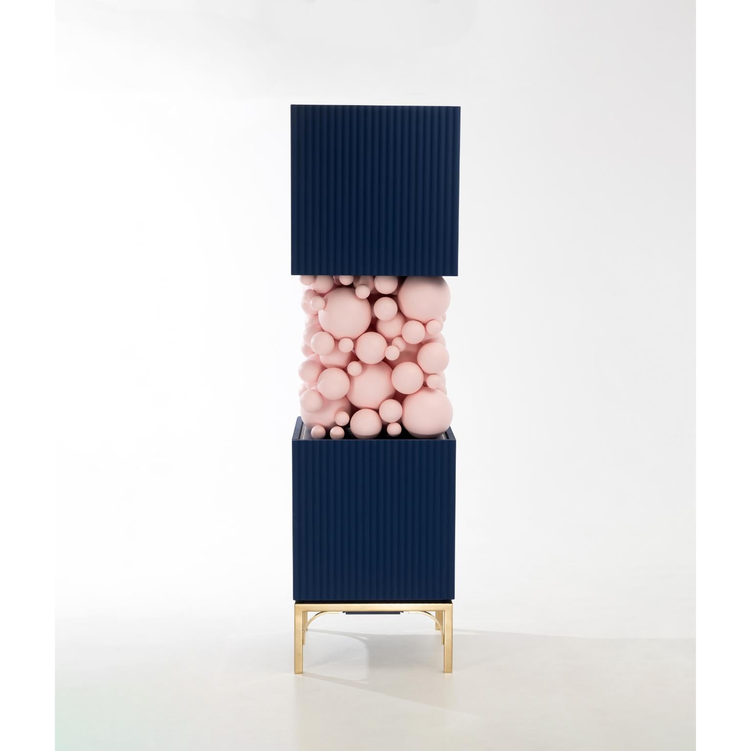 Brass And Pastel Pink Bubbles Cabinet by PANOPTIKUM COLLECTIONS
Dimensions: D 55 x W 55 x H 190 cm.
Materials: MDF,  brass paint, and LED lighting.

The “Bubbles collection” is an example of an emotional design that appeals to our inner child. The