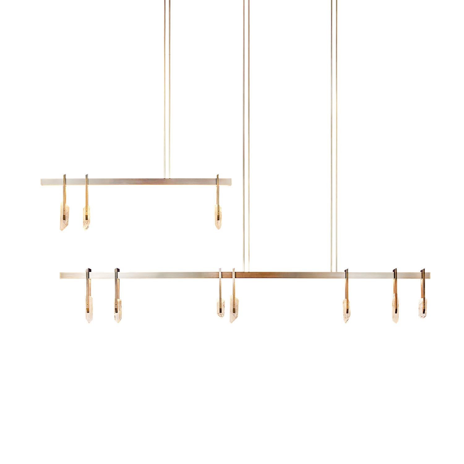Brass and quartz crystal pendant light - Abacus 1800 by Christopher Boots

The Abacus is a sophisticated tool dating back to 300 BC.
Sliding stones along a rod, ancient statesmen, merchants and mathematicians performed mathematical balancing acts