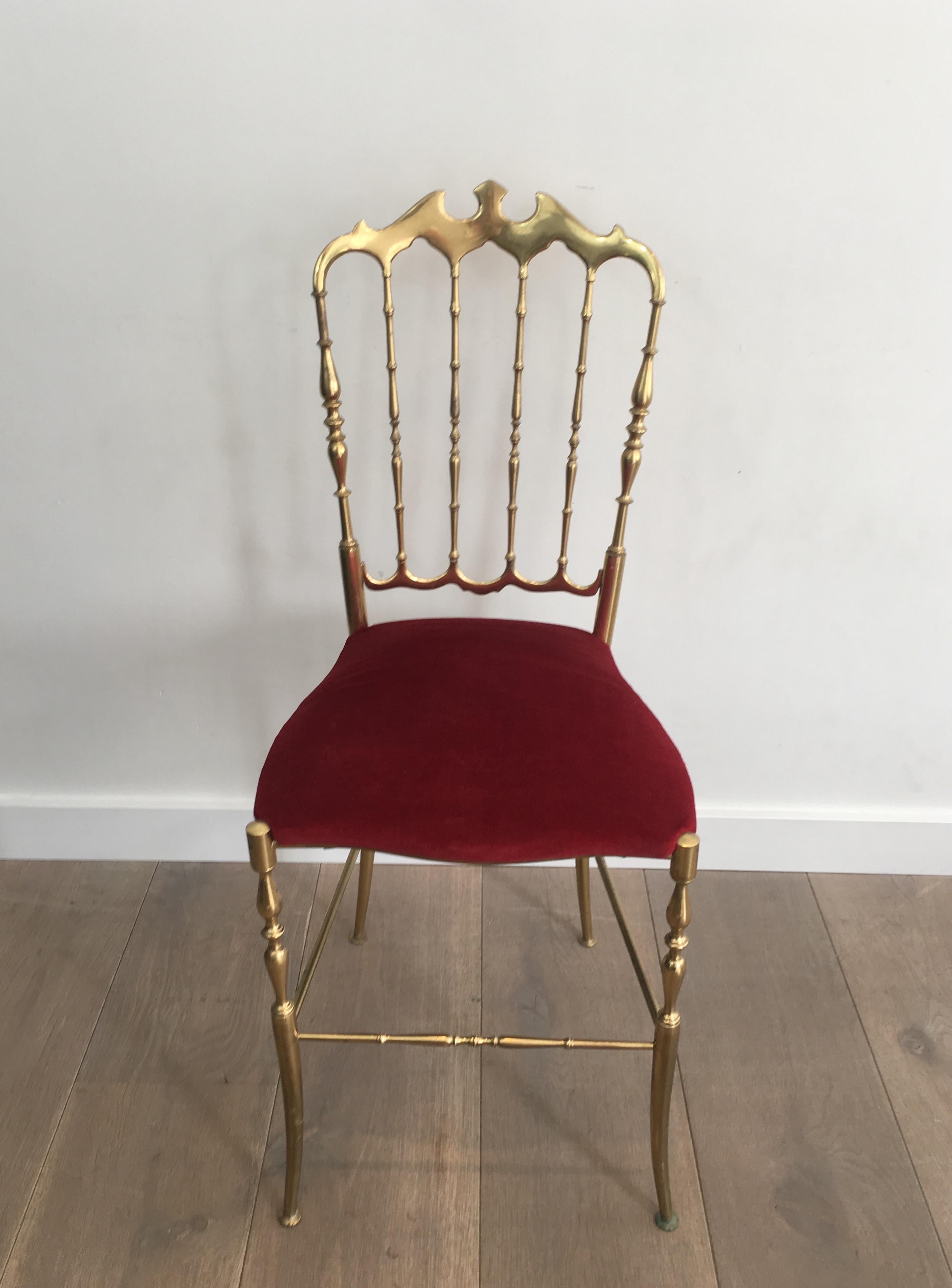 This Chiavari chair is all made of brass with a red velvet on the seat. The quality of this chair is a very nice. This is a French work, circa 1940.