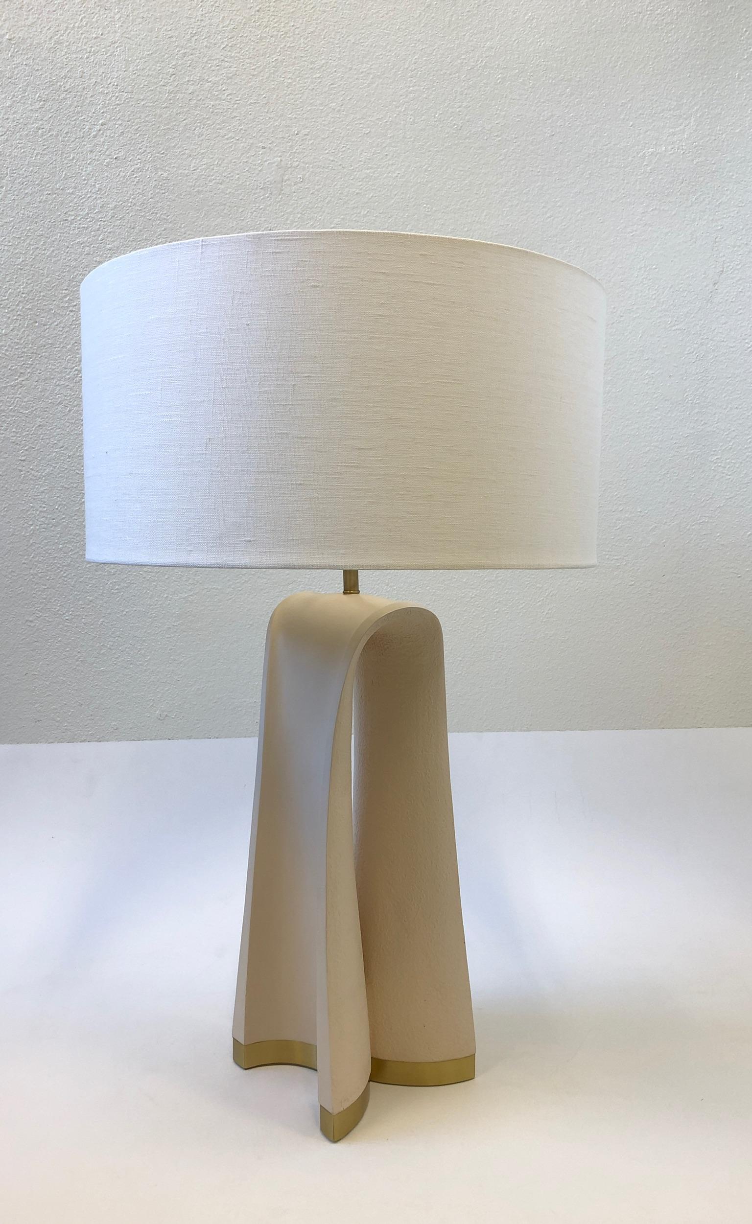 A spectacular 1980s sculpted plaster with brass hardware table lamp by Boyd Lighting. The lamp is signed by artist and retains the Boyd Lighting label (see detail photos). The lamp has a new vanilla linen shade, it has a full range dimmer that takes