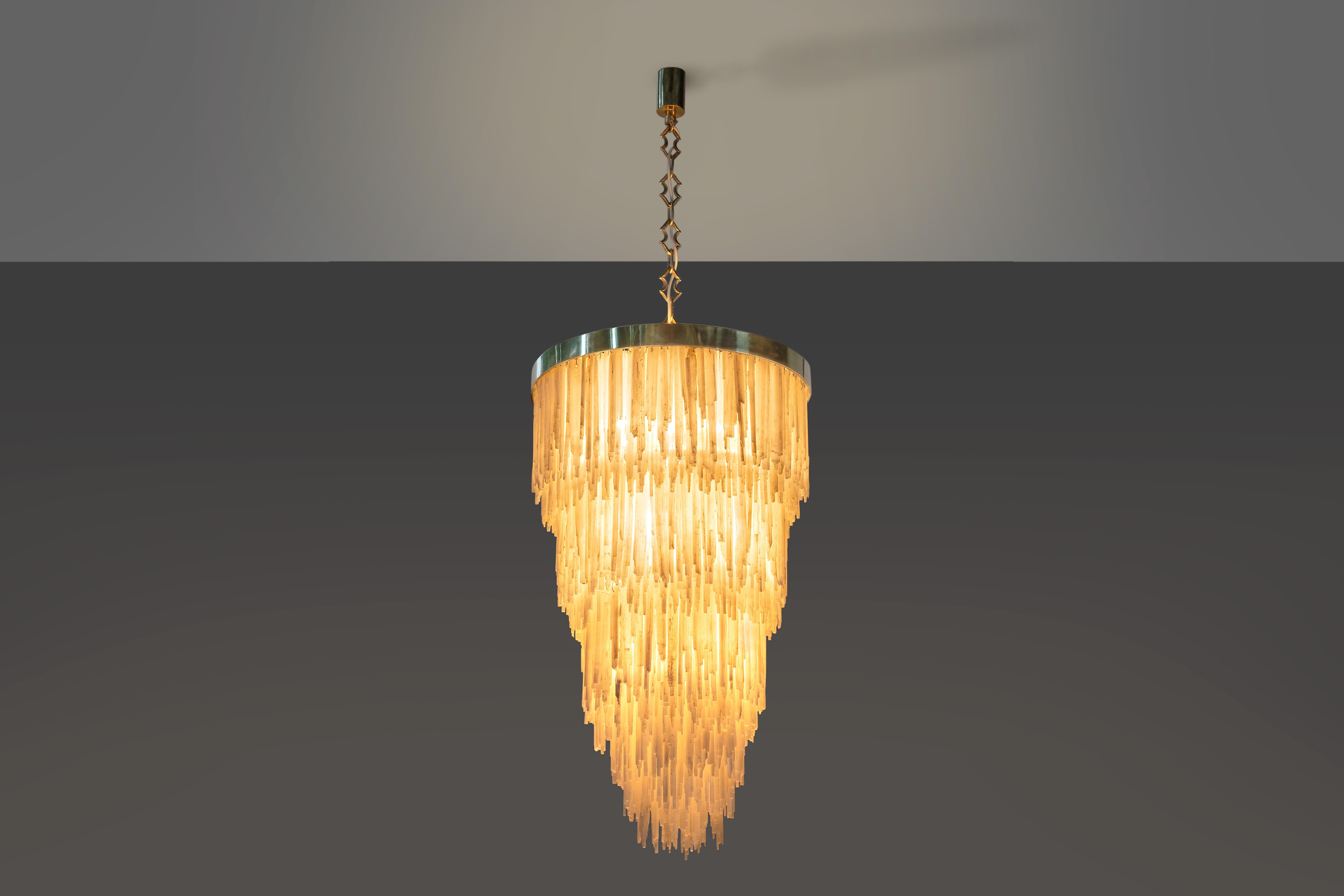 This chandelier shows how even stone - perceived as one of the heaviest materials - can convey lightness if correctly designed. Made out of Selenite, often considered a 