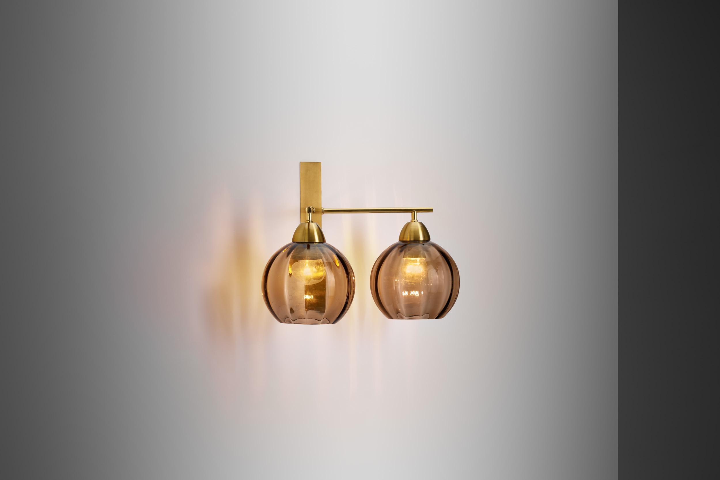 Swedish master of lighting design, Holger Johansson, brought much glamour into Swedish mid-century modernism. Without giving up the “form follows function” ideal of the era he created spectacular models, like this wall lamp.

The mid-20th century