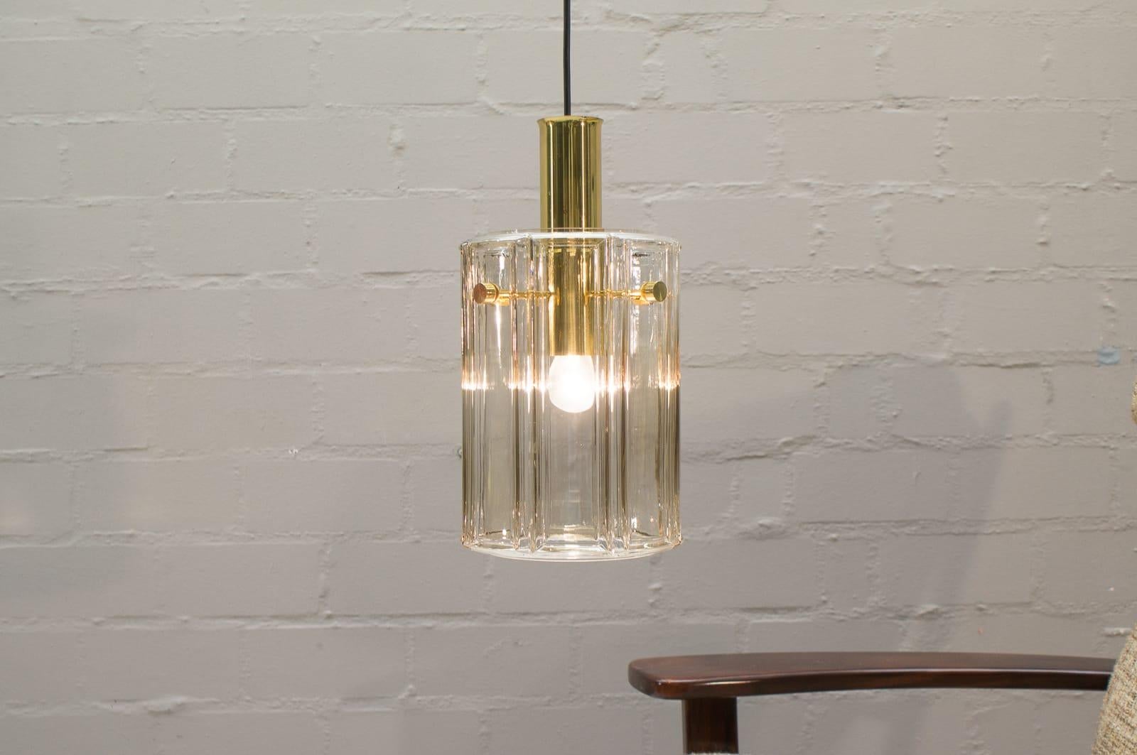 Vintage German pendant lamp in glass by Limburg. Previously hung in a church. E27 socket. Height changeable by the cable. Maximum height is 100 cm. From the 1960s.

The lamp is executed with an E27 Edison screw fit bulb. It is wired, and in