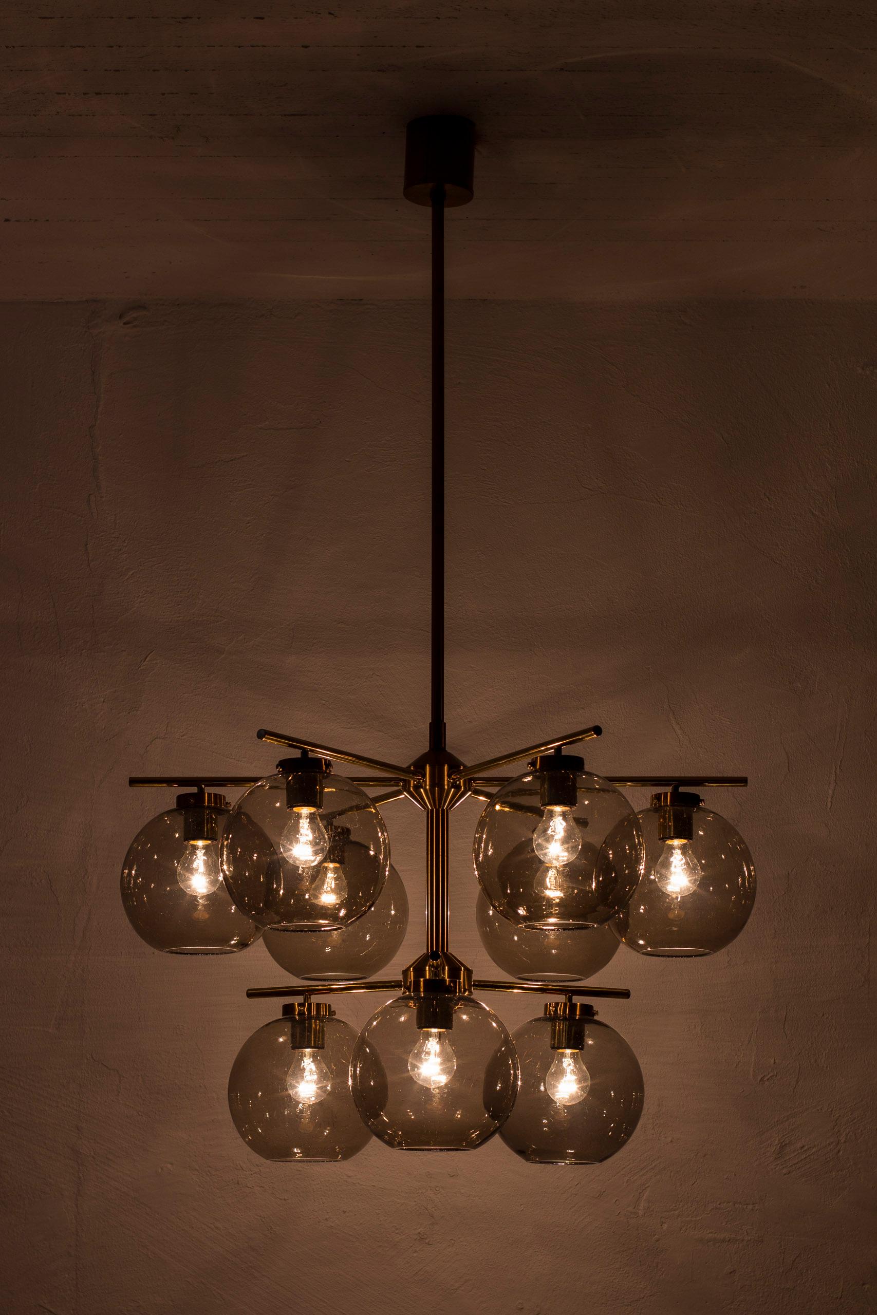 Mid-20th Century Brass and smoked glass chandeliers by Holger Johansson, Sweden, 1960s