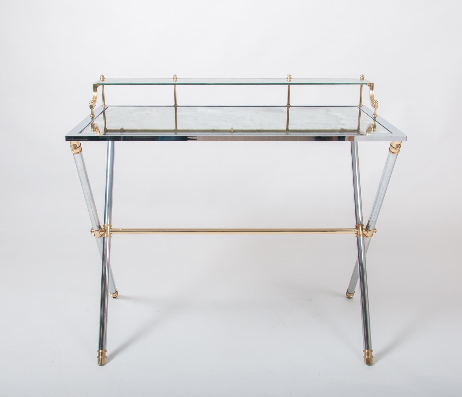Maison Jansen brass and steel desk, silver and gold patina with a rectangular mirrored top resting on a cylindrical X-frame base connected by a stretcher. Stamped “Jansen, 9 Rue Royale” France circa 1970

 

Maison Jansen was a Paris-based