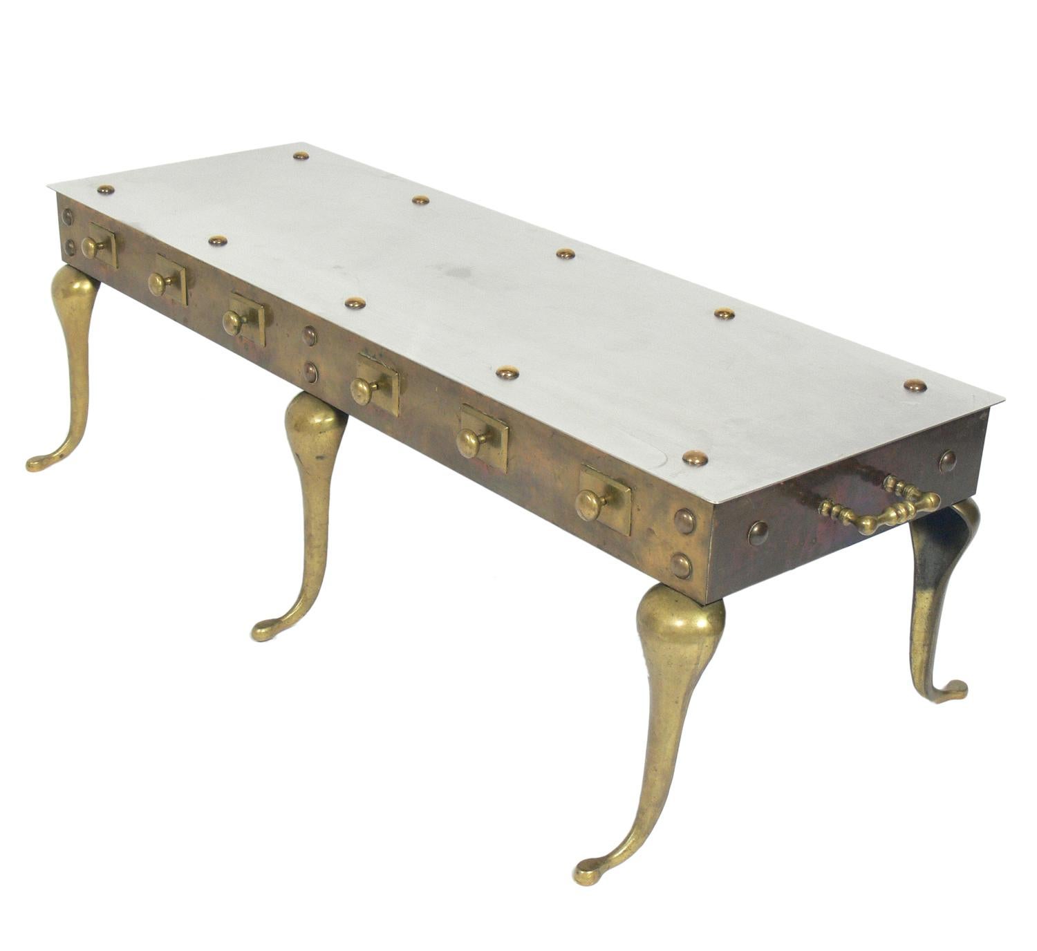 Brass and steel footman coffee table or bench, England, circa late 19th century. Originally used as a footman (a table used next to a cooking fire, where hot dishes and pots could be placed). This example has had it's top replaced with a steel top