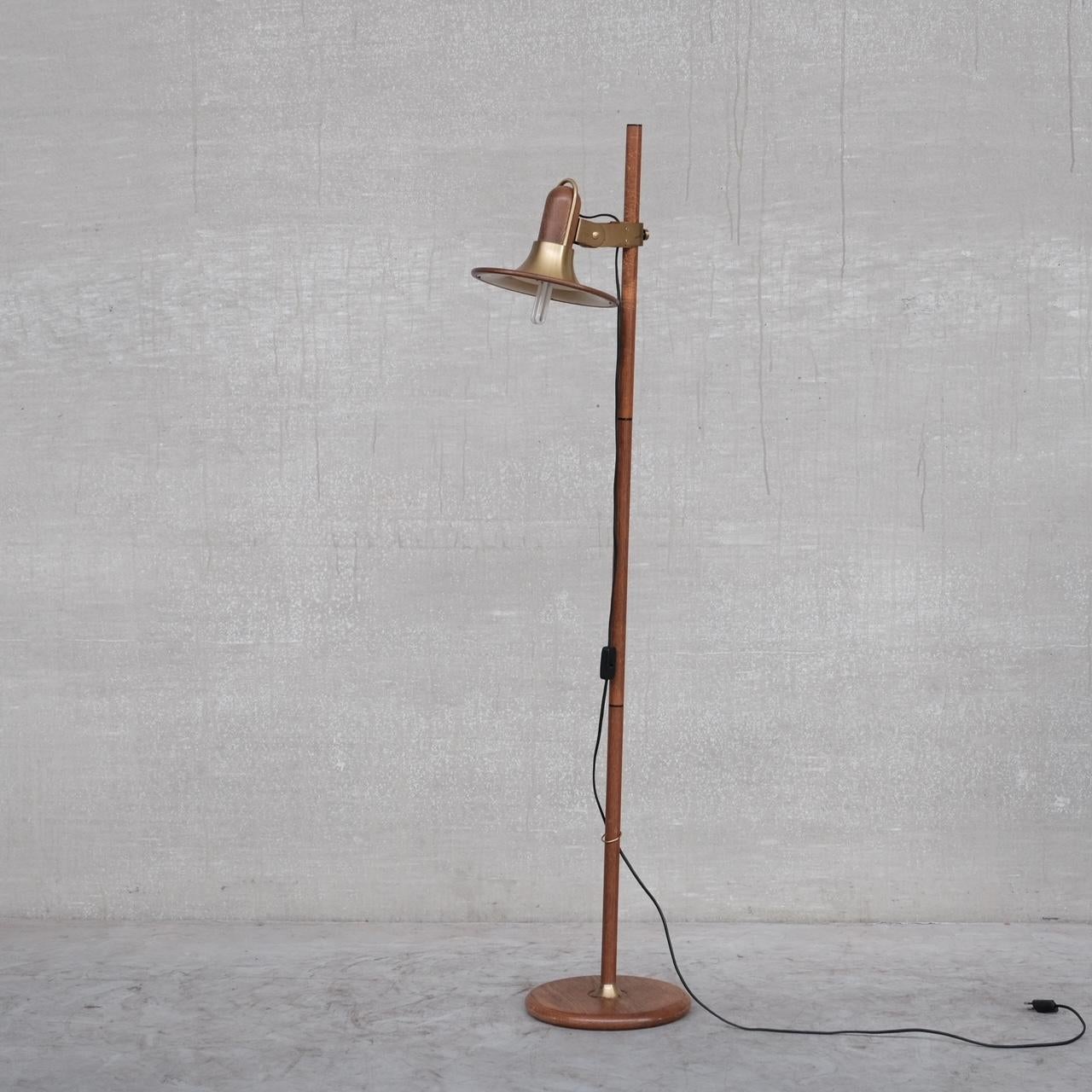 A brass and wooden floor lamp. 

France, c1970s. 

Good contrast of colours. 

Adjustable in height, there are some markings where the lamp has been adjusted over the years in the form of indents in the wood, we can restore these out upon