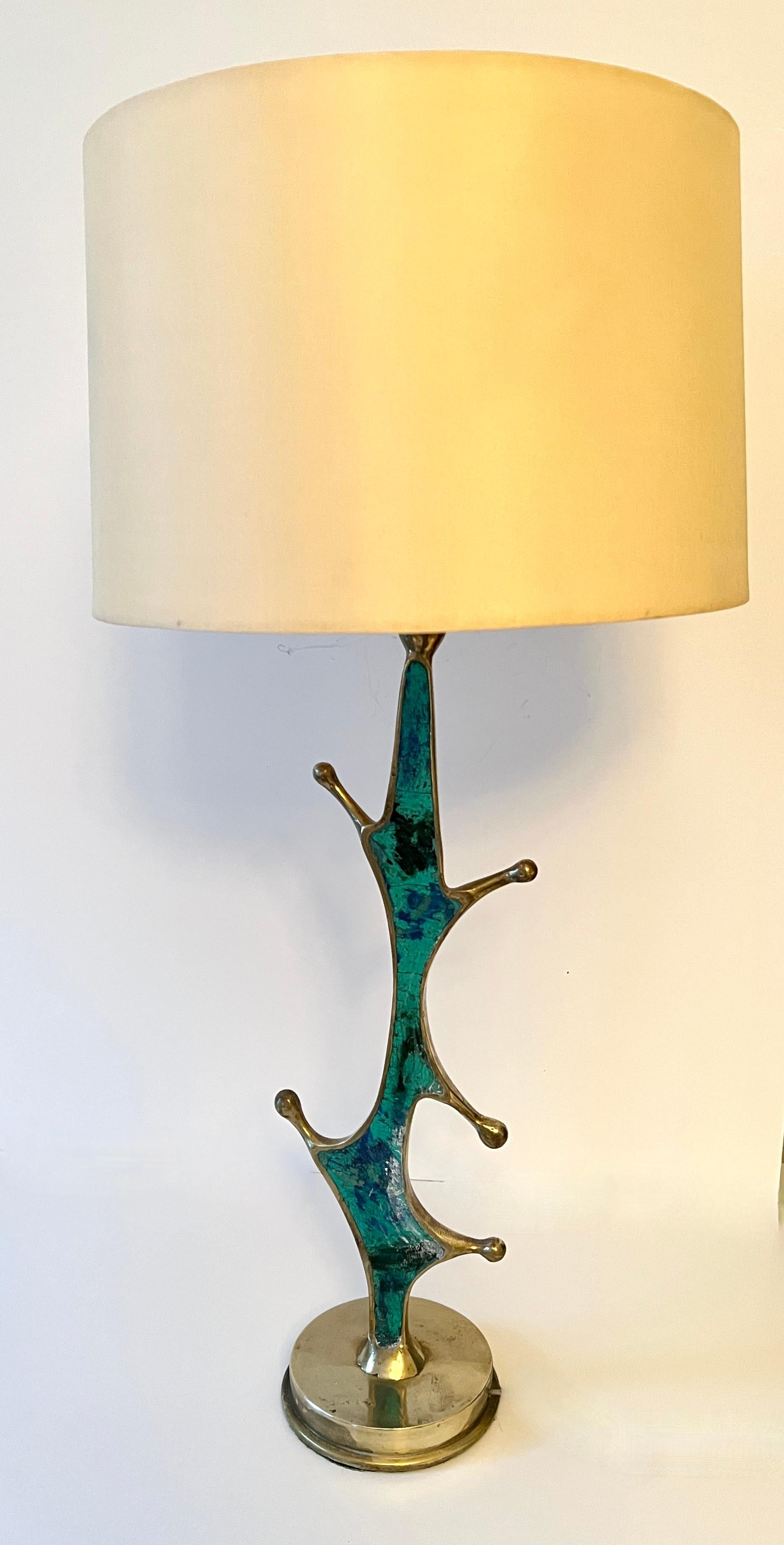 Mexican Artist, Pepe Mendoza, designs a wonderfully unique biomorphic Brass lamp with Turquoise Inlay.

The hand Crafted lamp is a complement to any desk or side table, bringing a modern, organic and Artistic jolt anywhere it is placed.  A guest