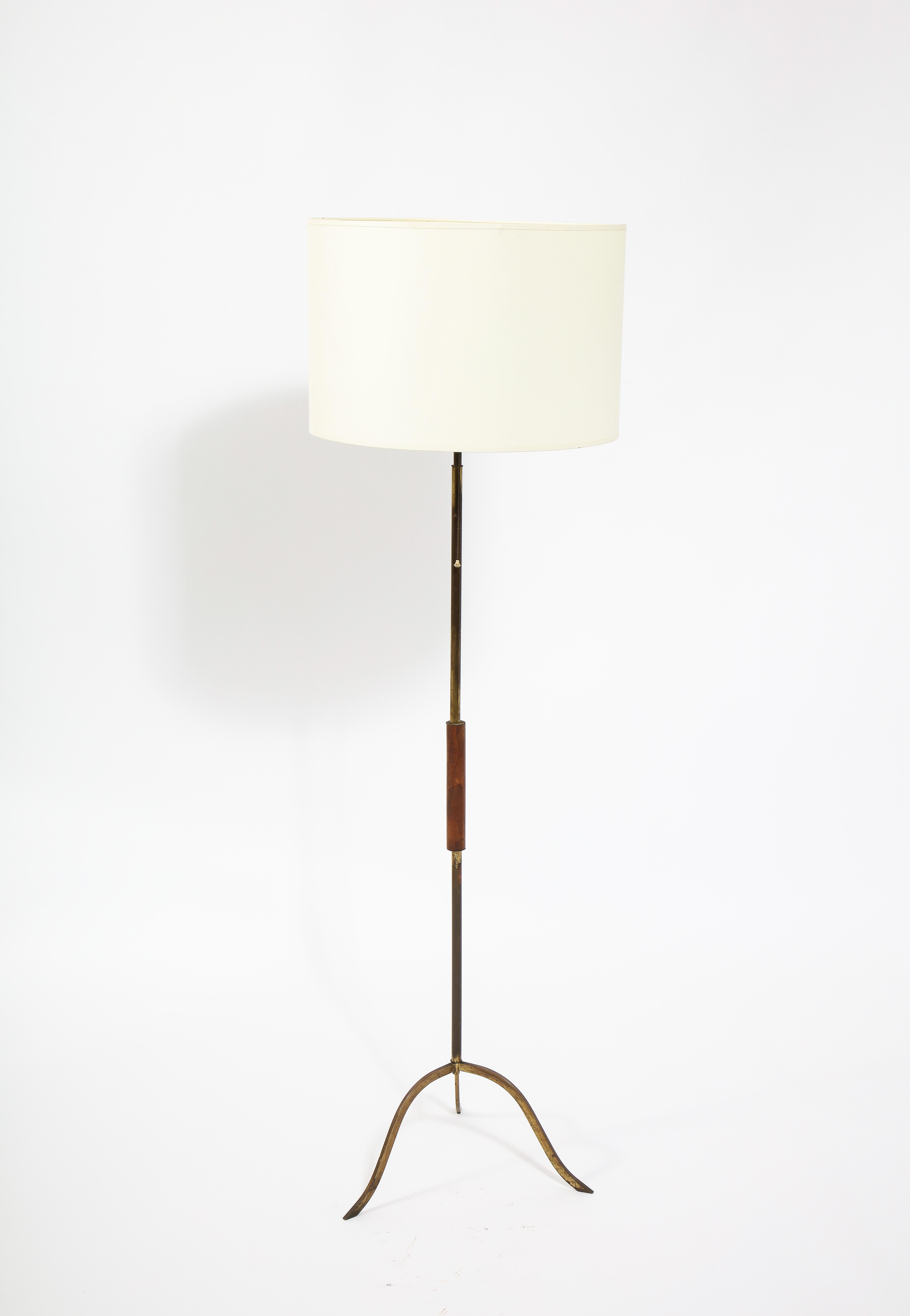Elegant tripod floor lamp in brass with a walnut handle. Shade for photographic purposes.
