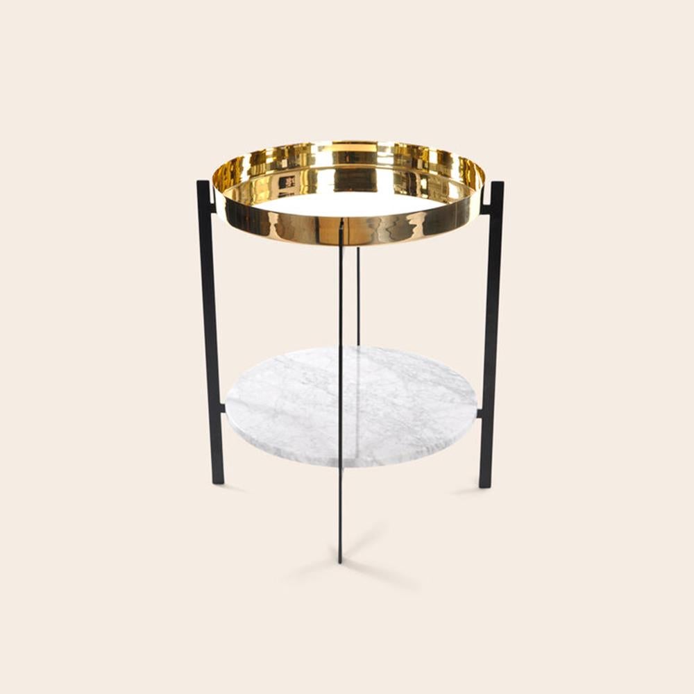 Brass and white Carrara marble deck table by OxDenmarq
Dimensions: D 57 x W 57 x H 67 cm
Materials: Steel, white Carrara marble, brass
Also available: Different tray conbinations available

OX DENMARQ is a Danish design brand aspiring to make