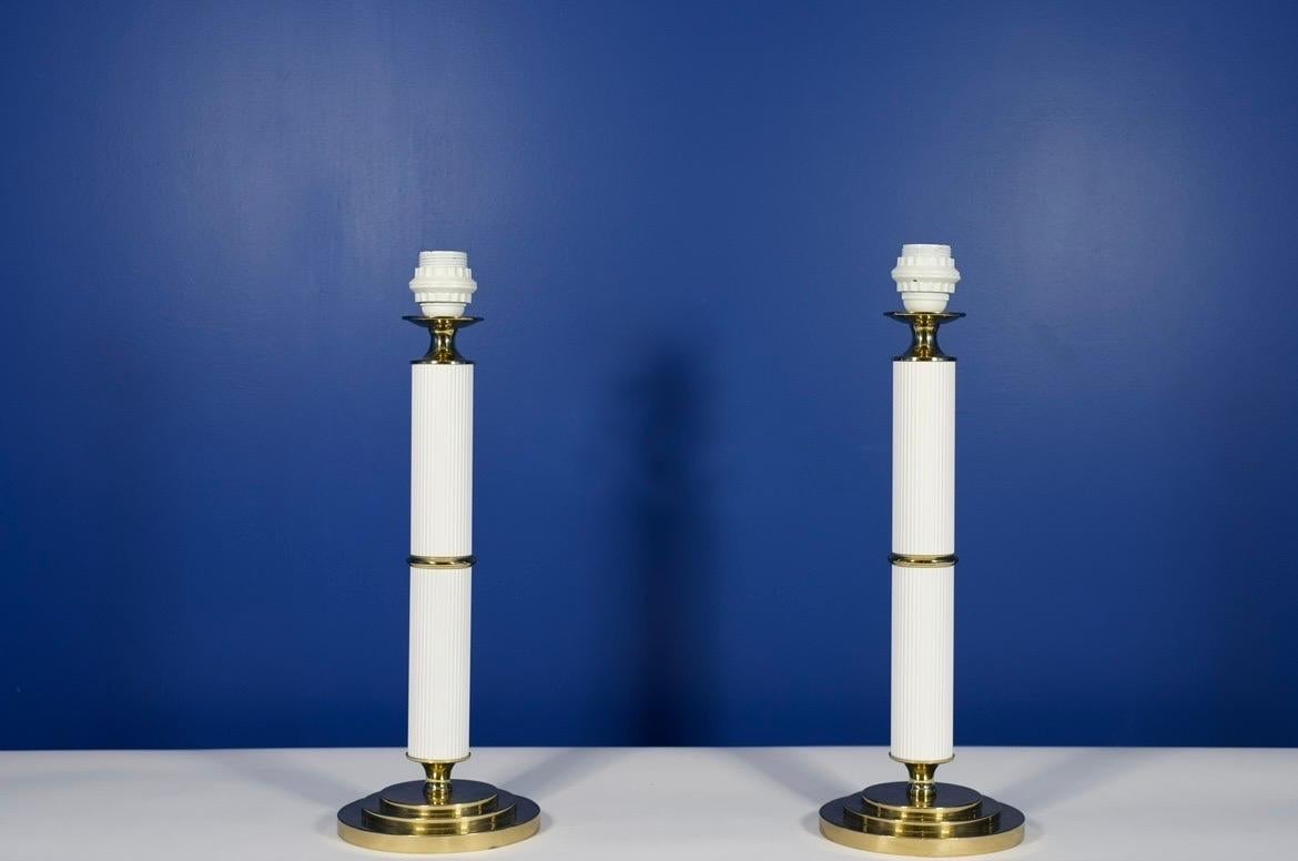 Pair of column brass and white bases table lamps . 1980 By Anfaco Taby Sweden.
Comes rewired for the US.