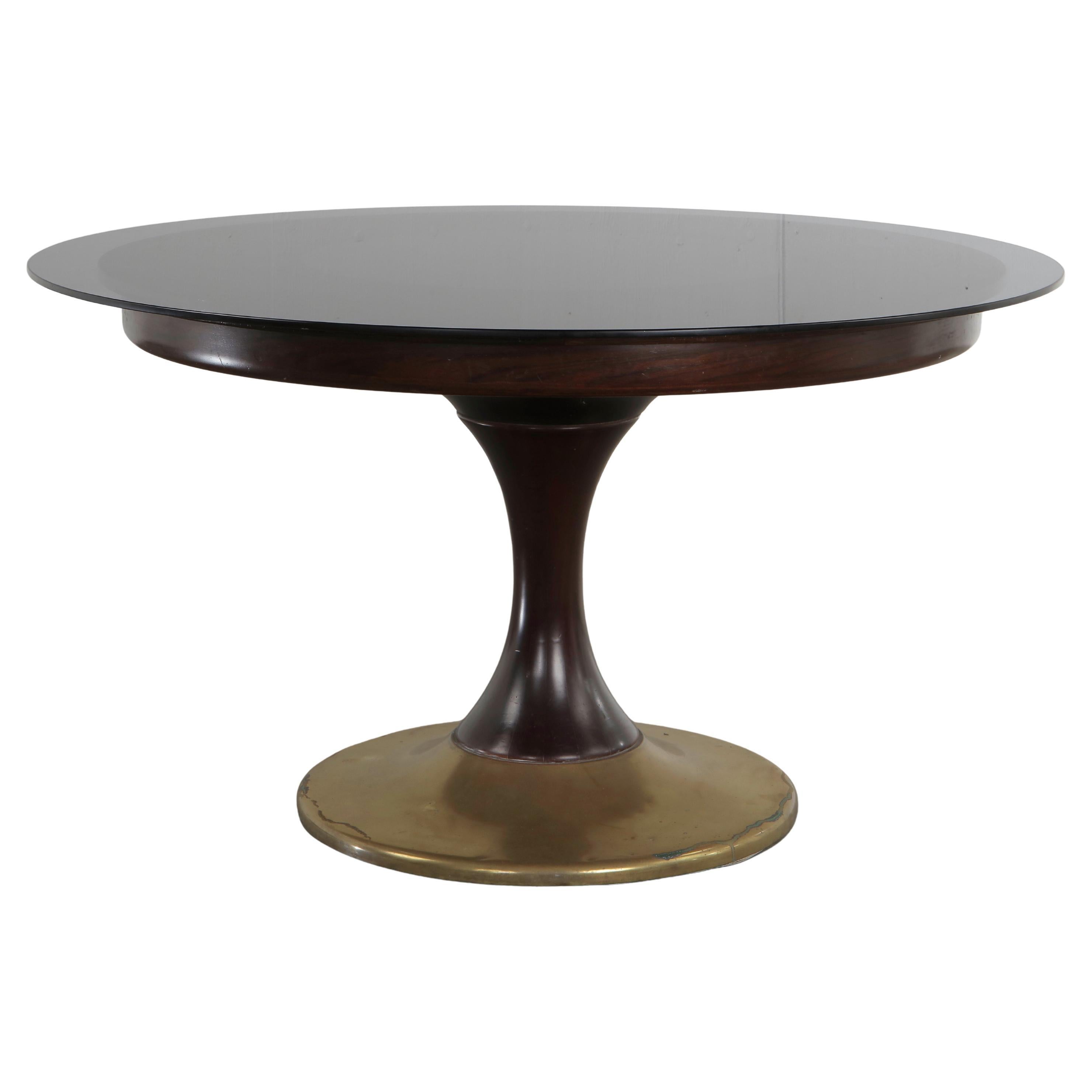 Tavolo da pranzo allungabile con base in ottone e legno e piano in vetro, anni 
70 in vendita