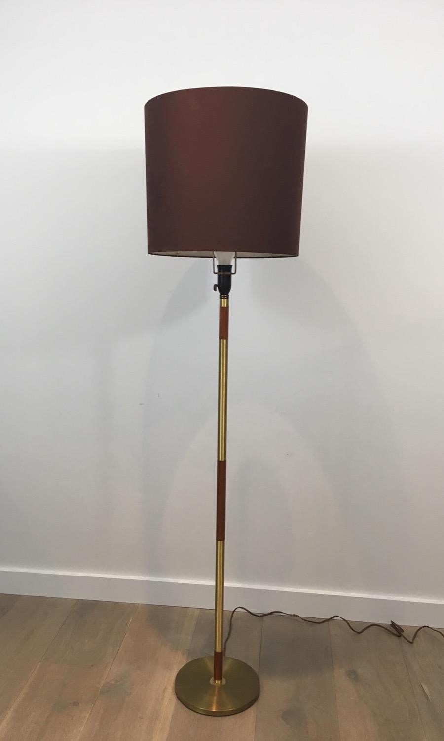 Brass and wood floor lamp. French, circa 1970
The shade is the original one and can be used. We can quote a replacement.