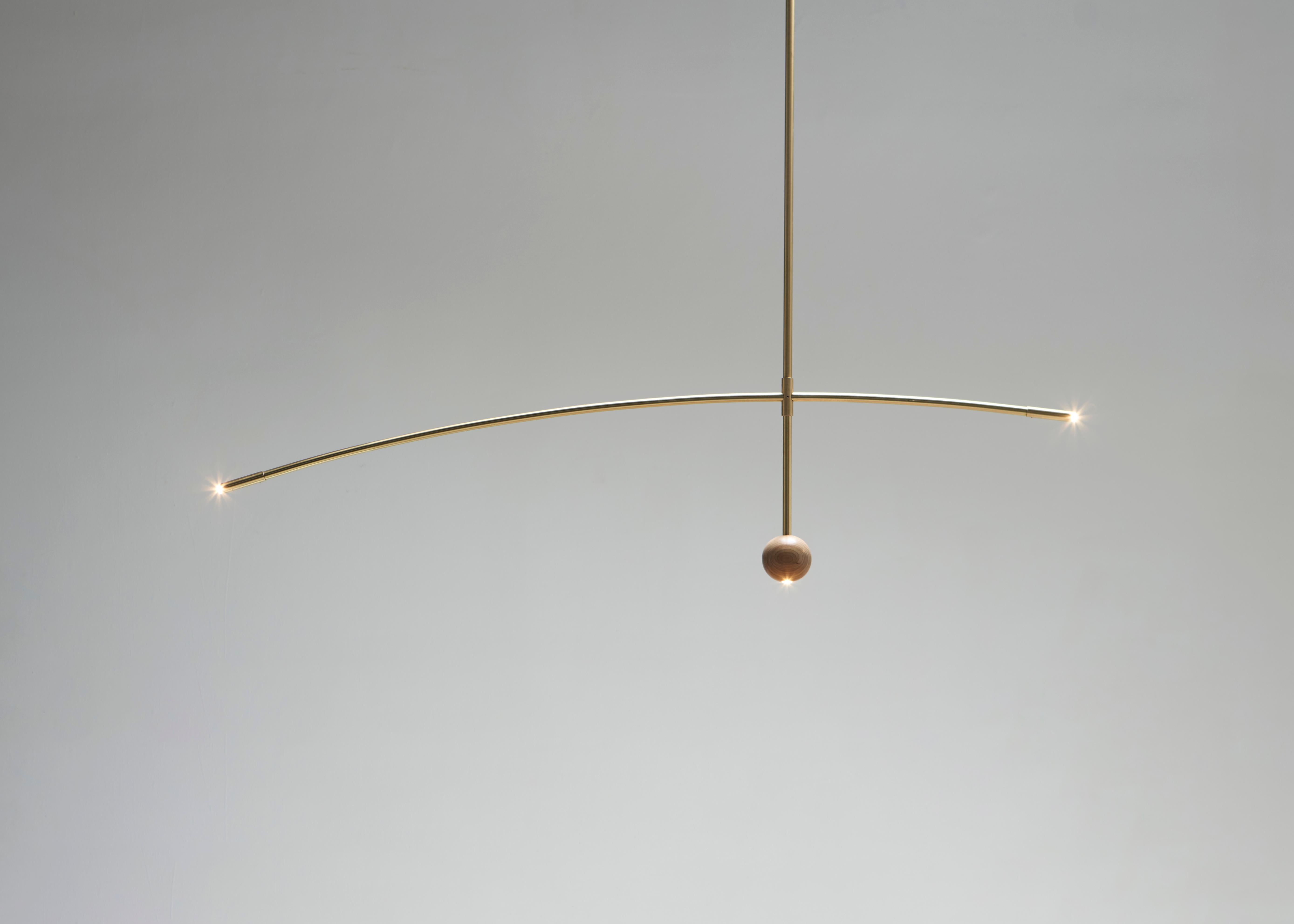 Flutua Luminária in ottone e legno di Andre Ferri Atelier
Dimensioni: D 180 x H 40 cm. 
Materiali: Wood, ottone. 

ANDRÉ FERRI
André Ferri è di Belo Horizonte, nato nel 1990, laureato in Architettura e Urbanistica con una specializzazione in