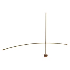 Flutua Luminária in ottone e legno di Andre Ferri Atelier