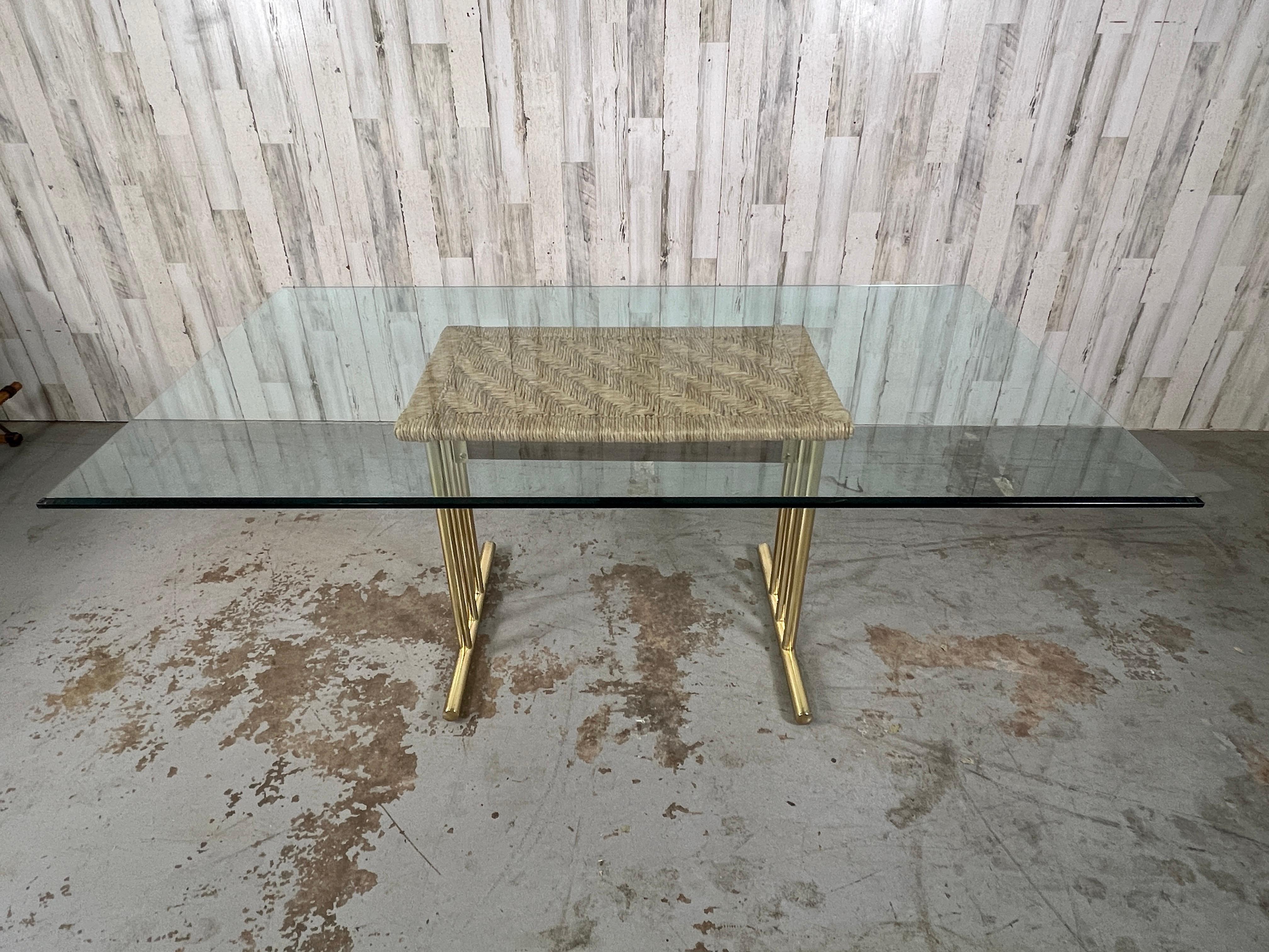 Geometric design woven into the rush top of this Chrome Craft original dining table. The brass trestle style base is a great compliment  to the modern aesthetic.  The glass top is optional.
Base measures: 19 3/4