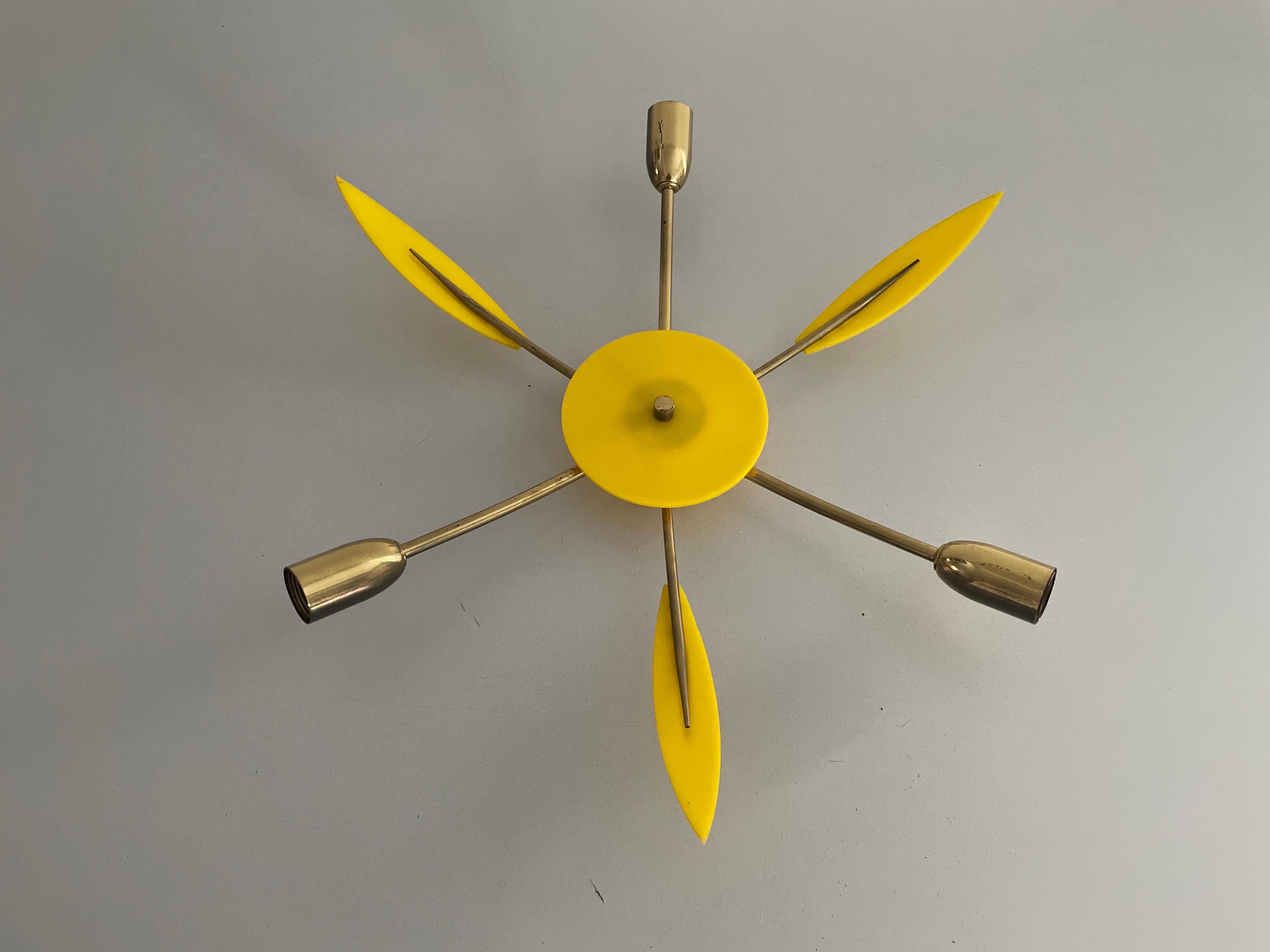 Brass and Yellow Plexi Sputnik Flush Mount Light, 1970s, Germany

Lampshade is in very good vintage condition.

This lamp works with  3x E14 light bulbs. 
Wired and suitable to use with 220V and 110V for all countries.

Measurements:
Diameter: 46