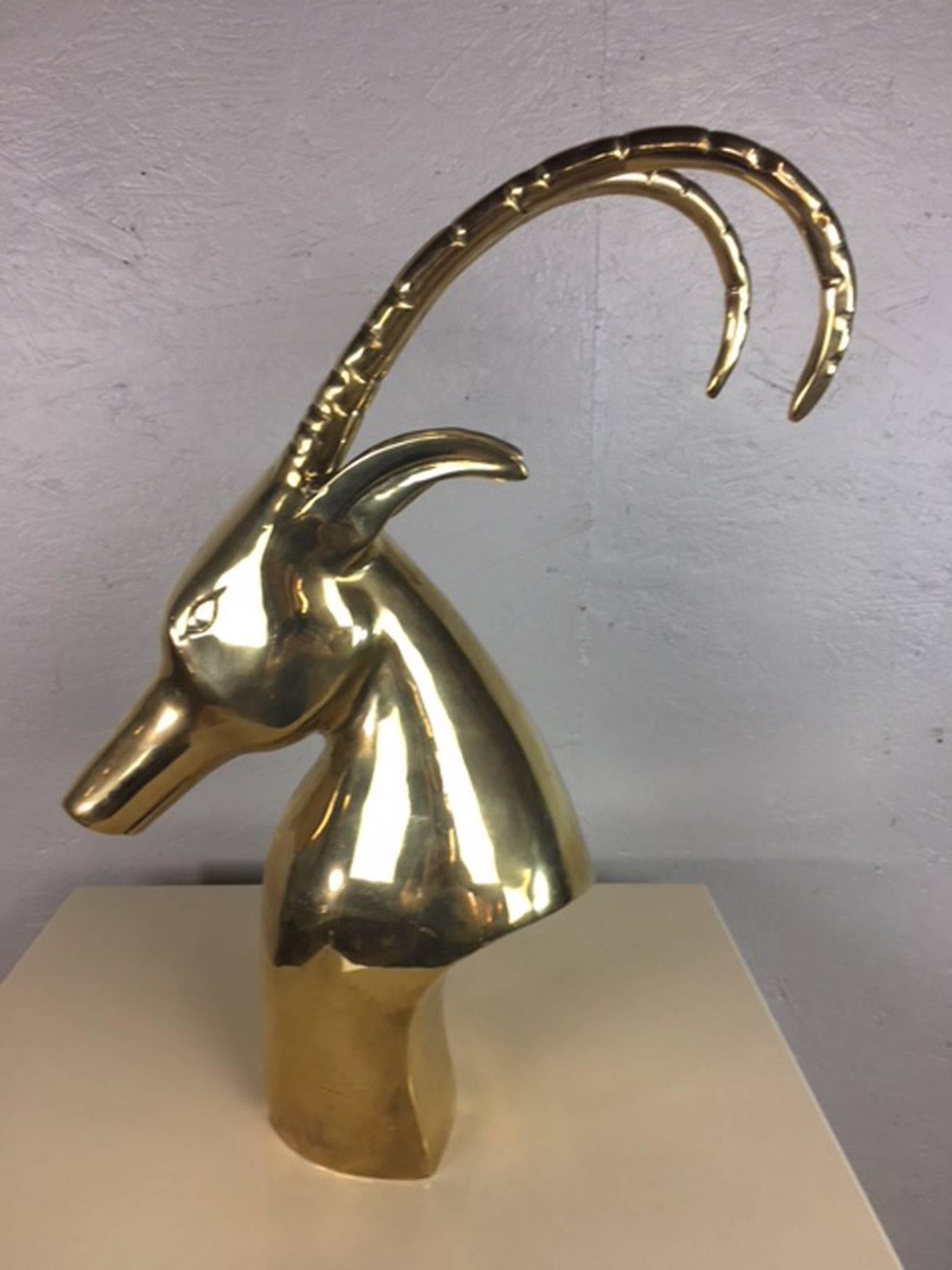 Unique antelope head sculpture in brass. Artist unknown.