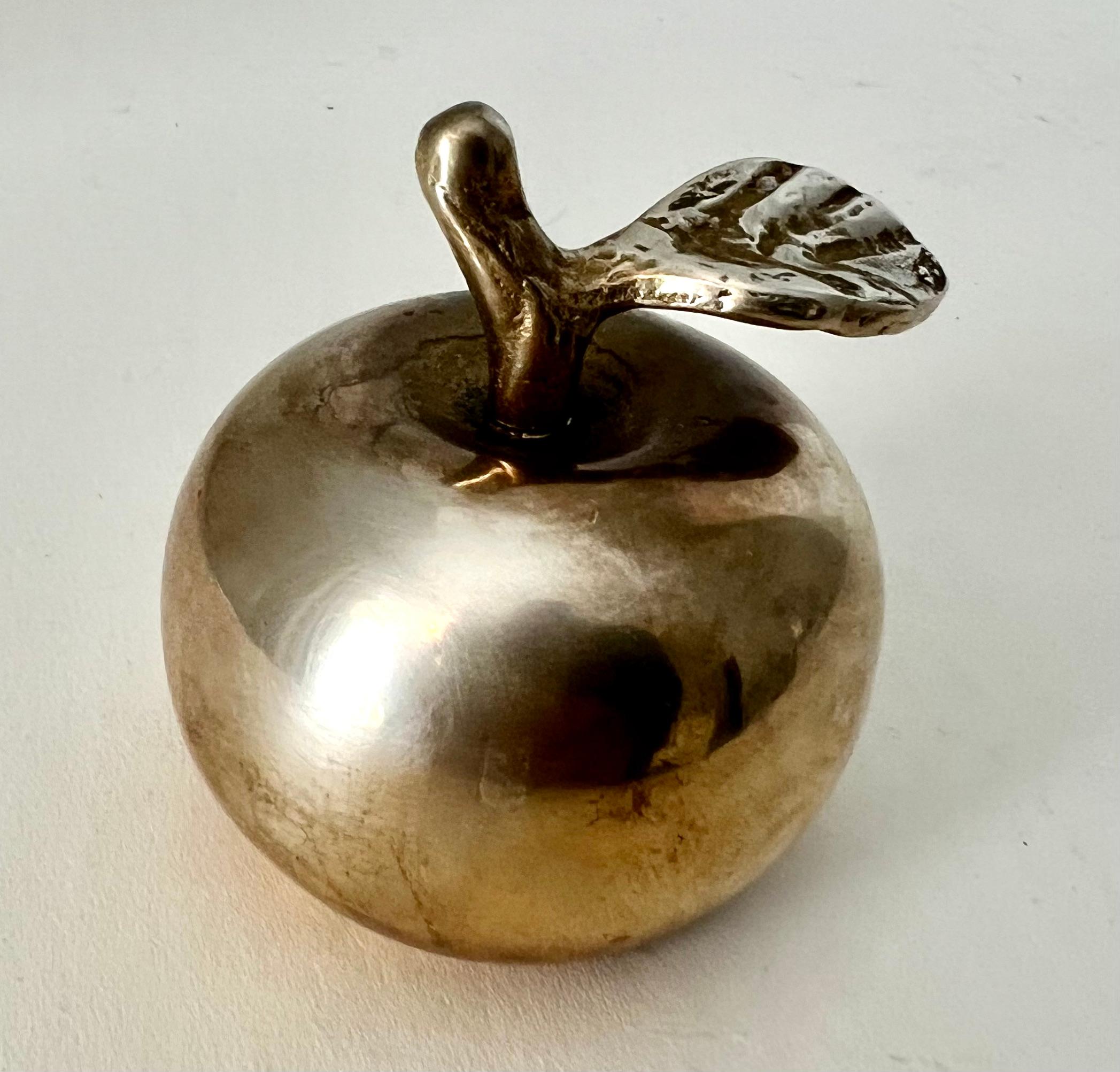 A Brass Apple and a bell. A novel piece, perhaps for the desk or work station, or babies room.. and always a gift for your favorite teacher. The bell has a nice sound.