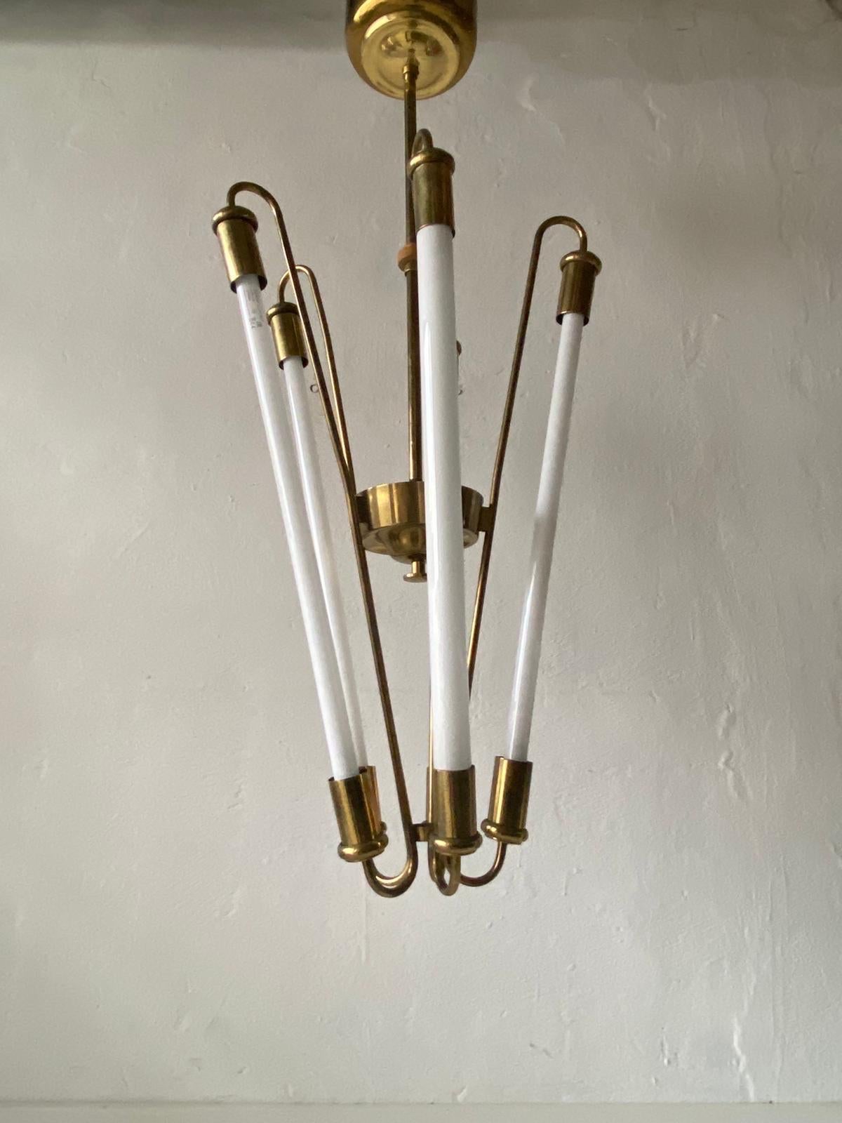 Brass Art Deco Bauhaus chandelier by Kaiser & Co., 1930s, Germany

Lampshade is in very good vintage condition.
Original canopy.

This lamp works with 5 fluorescent Tubes.
Wired and suitable to use with 220V and 110V for all