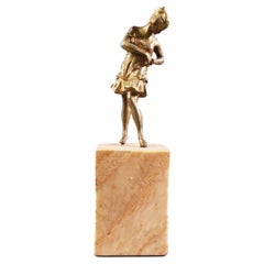 Antique Brass Art Deco Flapper Girl Sculpture on Peach Marble obelisk