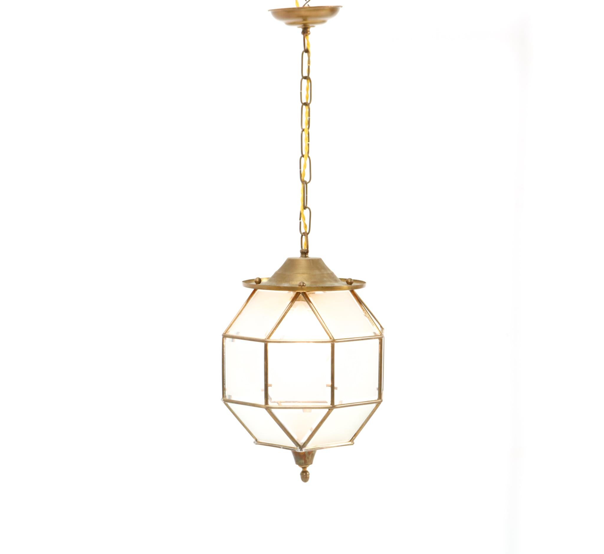 Stunning and rare Art Deco lantern.
Striking Dutch design from the 1920s.
Brass frame and chain.
Original cut glass which has no cracks or hidden damages.
Rewired with one original socket for E-27 light bulb.
This wonderful Art Deco lantern is