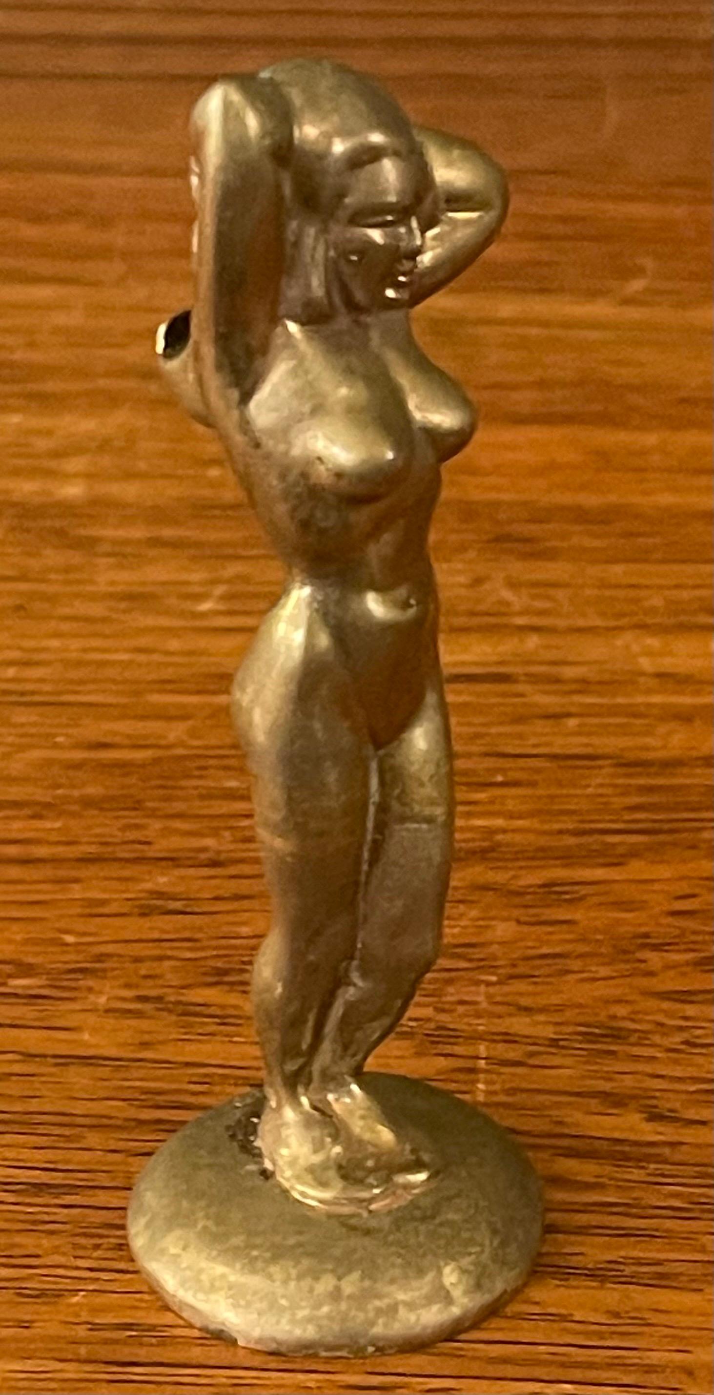 A fun brass art deco nude woman bottle opener, circa 1940s. The piece is in very good vintage condition with a great patina and measures 1.5