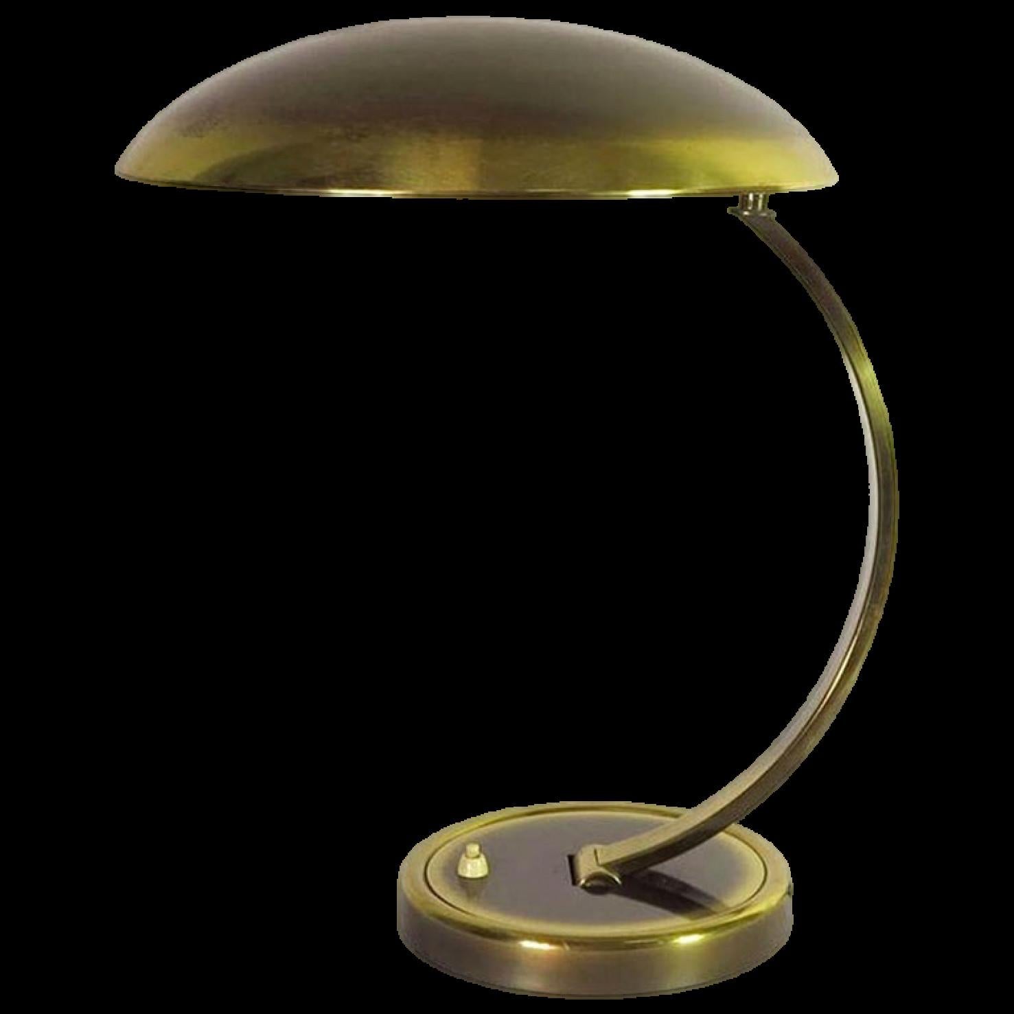This beautiful patinated brass table lamp was designed by Christian Dell and was produced by Kaiser Idell in the 1950s. Both arm and shade are adjustable.

Industrial designer, silversmith, and teacher Christian Dell was born in 1893 in Offenbach,