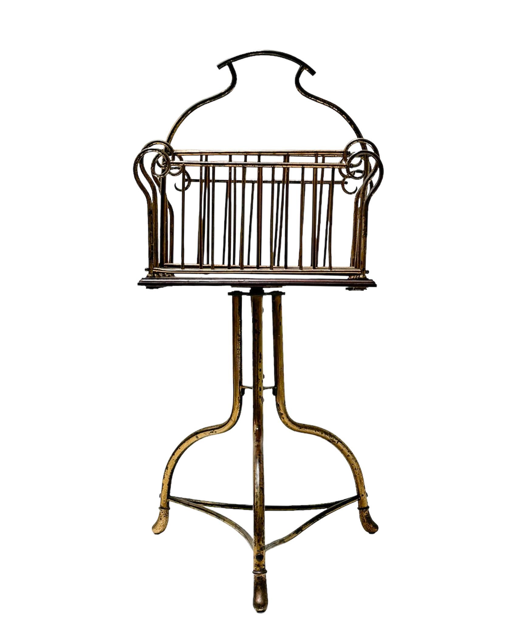 Stunning and elegant Art Nouveau revolving magazine rack.
Striking English design from the 1900s.
Patinated brass and walnut frame on a revolving stand.
This wonderful Art Nouveau revolving magazine rack is in good original condition with minor wear