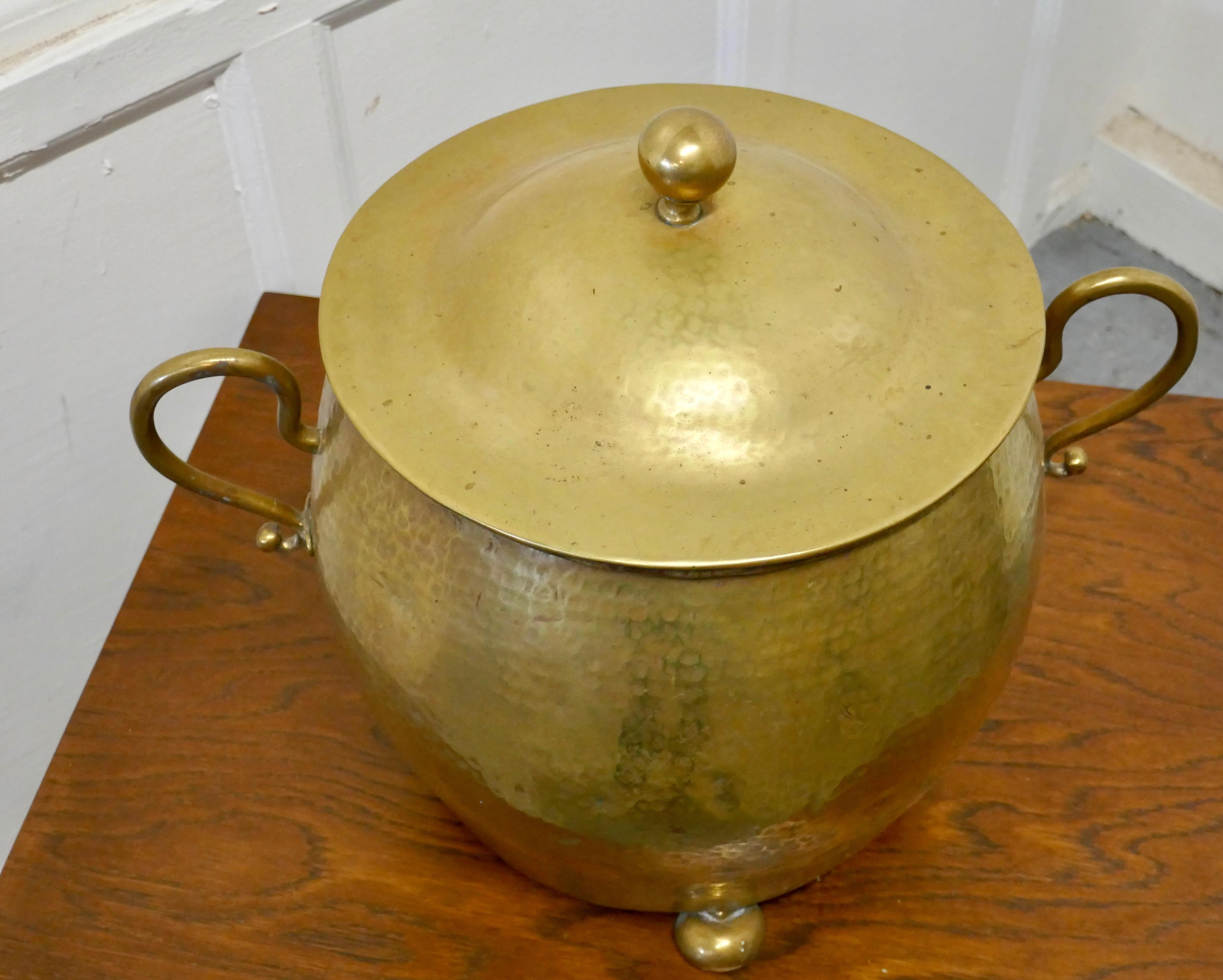 Brass Arts & Crafts coal bucket with lid

A superb design and a heavy quality piece, in beaten brass, it stands on 3 bun feet has a “Pot Belly” shape with 2 jug handles and lid
The coal bucket is in very good condition and has a Zinc liner with