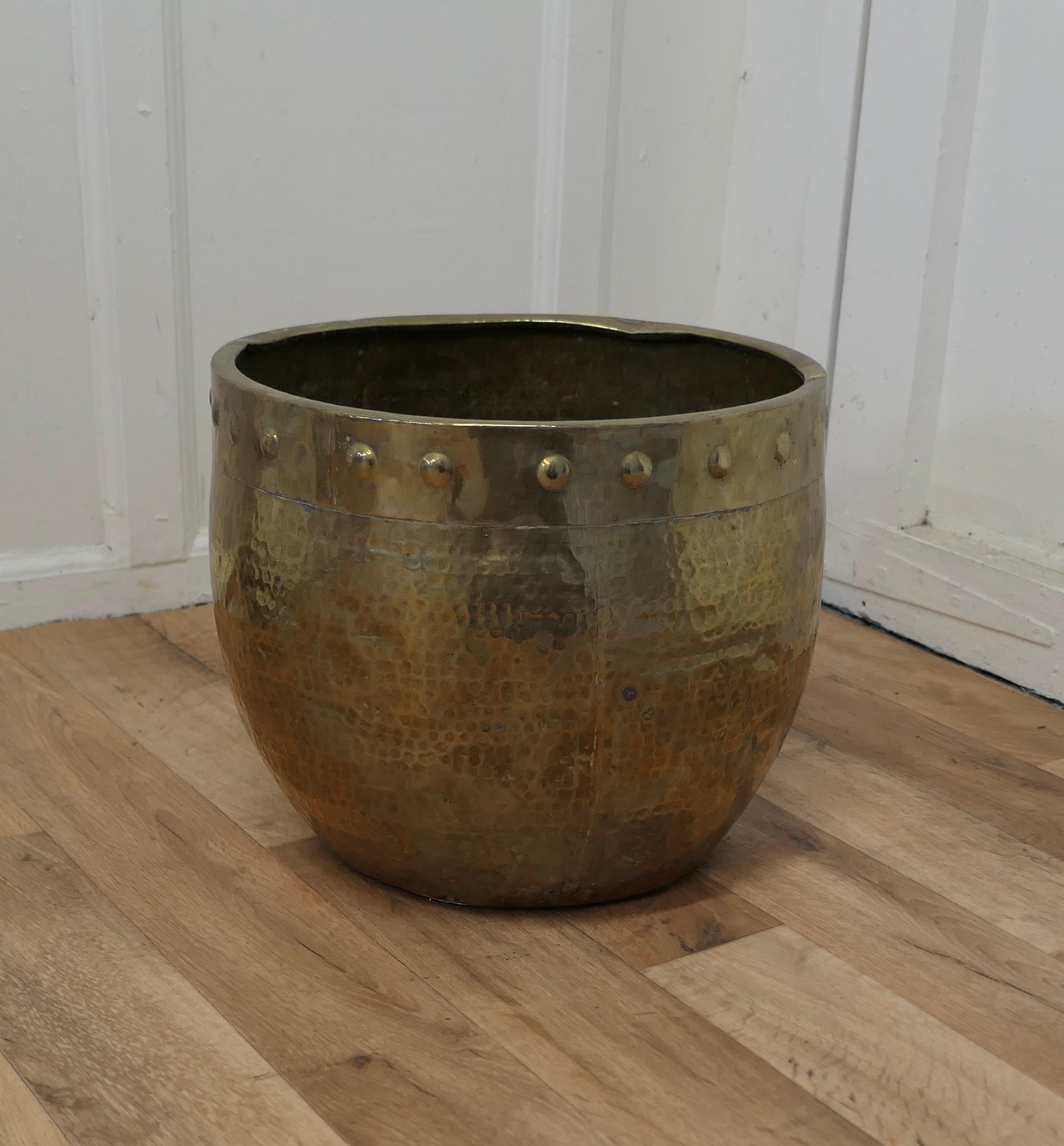 Brass Arts and Crafts Riveted Jardiniere  

A traditional design in beaten brass, with a “Pot Belly” shape 
The jardiniere is in reasonable condition for its age, it could also be used as a useful Coal Bucket 

The Coal B bucket or Jardiniere is 12”