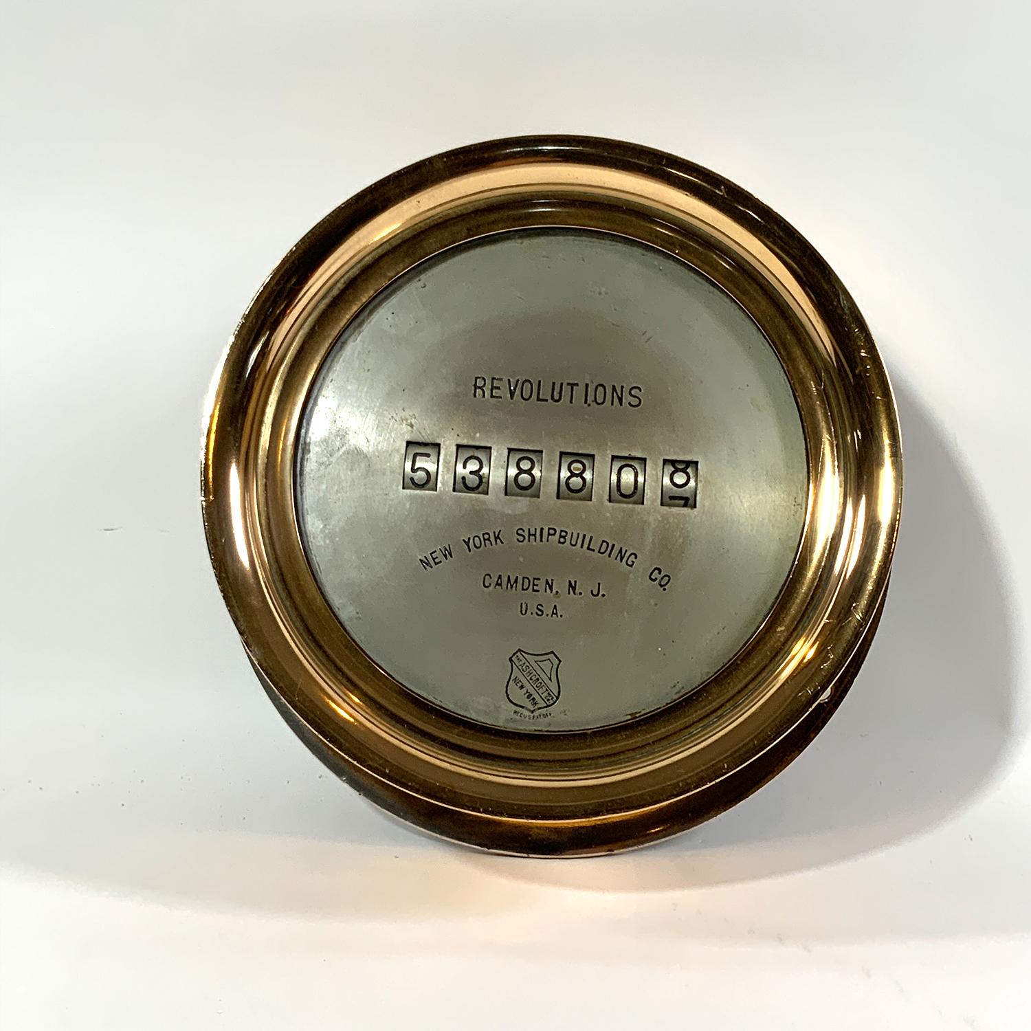 Ships Revolution Counter by Ashcroft Mfg. Co New York. 8 inch face inscribed New York Ship building Co. Camden, N.J. USA. Nickel plated over brass with nickel or silvered face. Overall 10 3/4 diameter x 4 inches tall. Weight 12 pounds. Hinged face