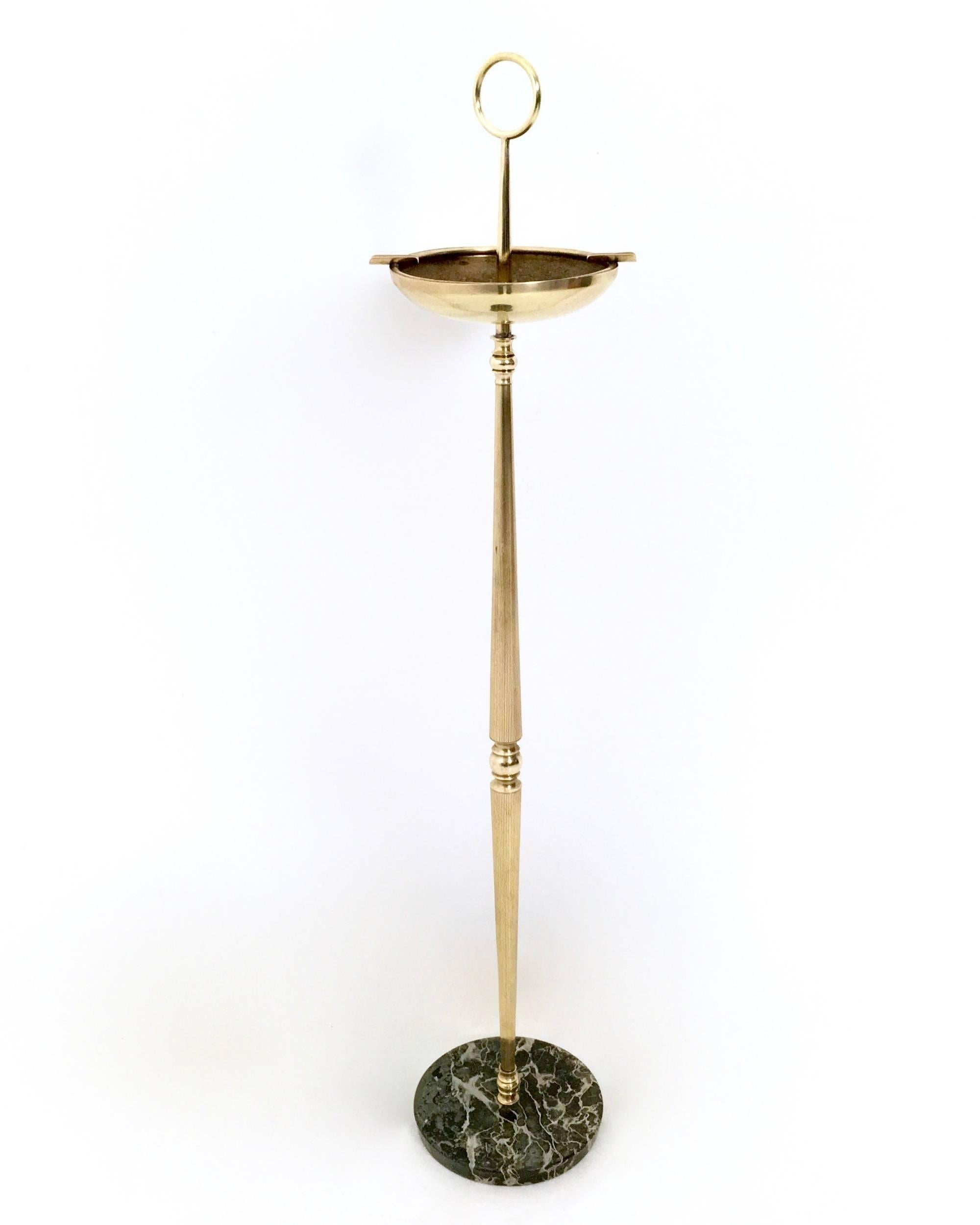 Made in brass, it features a Portoro marble base.
In very good original condition and ready to become a piece in a home.

Measure: Diameter 20 cm 
Height 85 cm. 

 