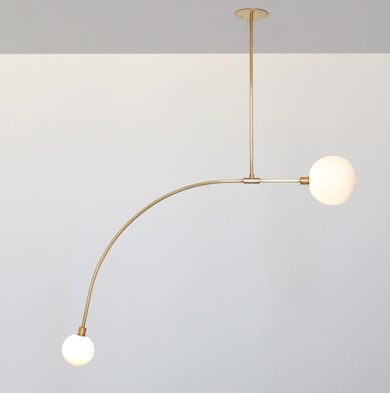 Brass Balance 1.0 pendant lamp by SkLO
Dimensions: D 114.5 x H 66.5 cm
Materials: white glass, brushed brass
Available in clear, new blue, olivin, smoke and white.
Available in 4 metal finishes: dark oxidized, brushed brass, polished nickel,