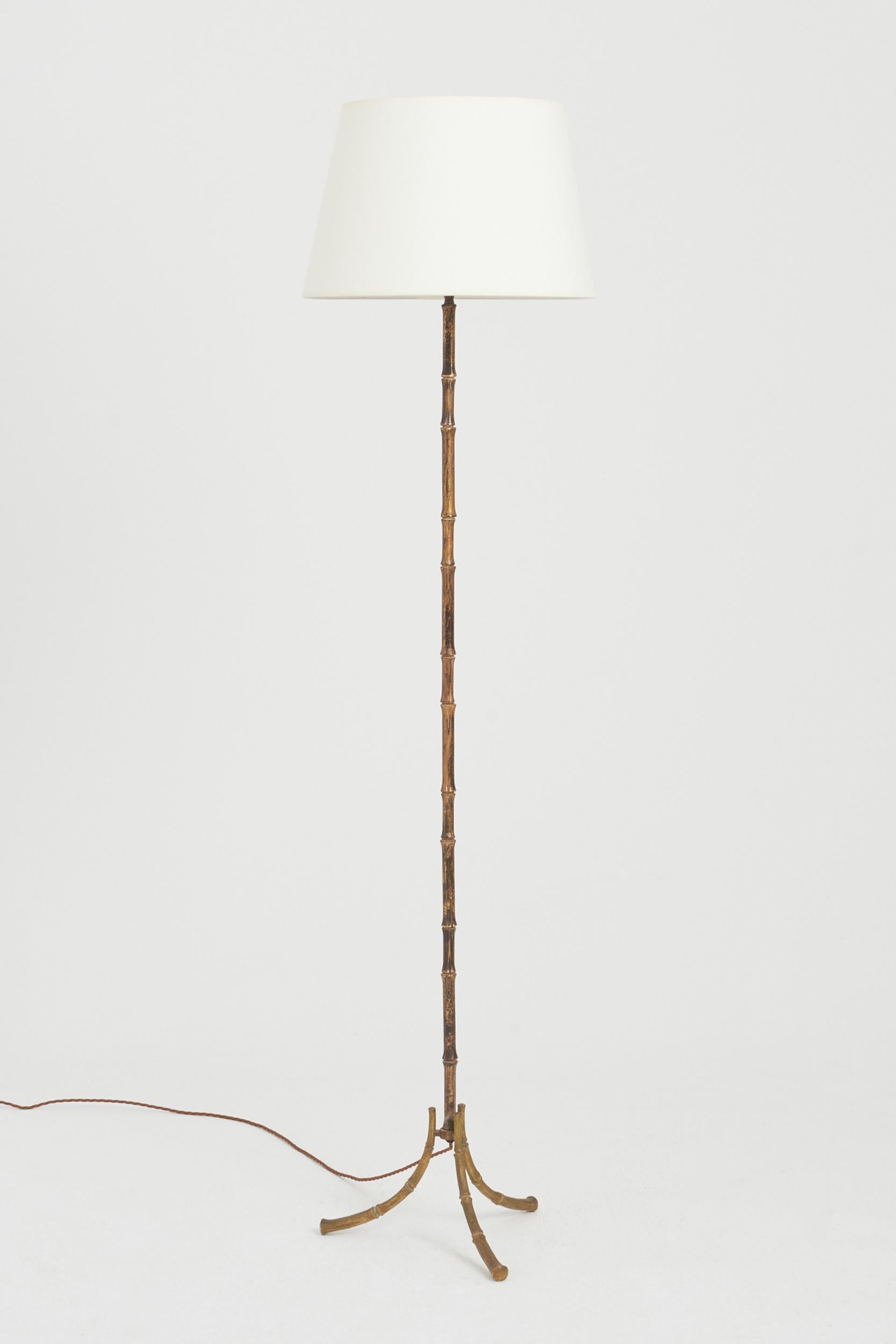 A brass stylised bamboo floor lamp.
France, 1970s
With the shade: 160 cm high by 41 cm diameter
Lamp base only: 142 cm high by 35 cm diameter.