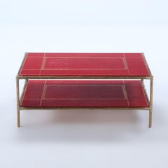 Brass bamboo form coffee table C 1970 with red leather top, manner of Jansen