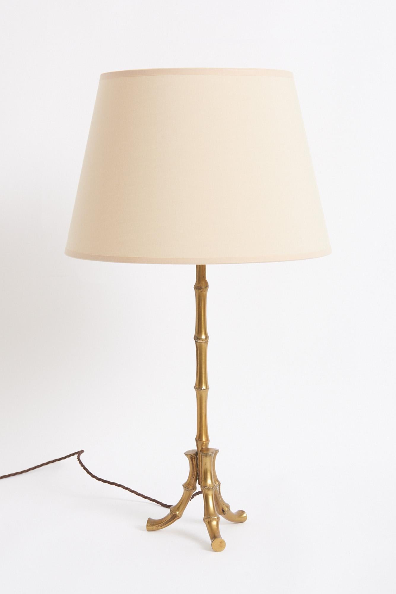 A brass stylised bamboo table lamp, possibly by Maison Baguès.
France, mid 20th century
With the shade: 61 cm high by 30.5 cm diameter
Lamp base only: 45 cm high by 15 cm diameter