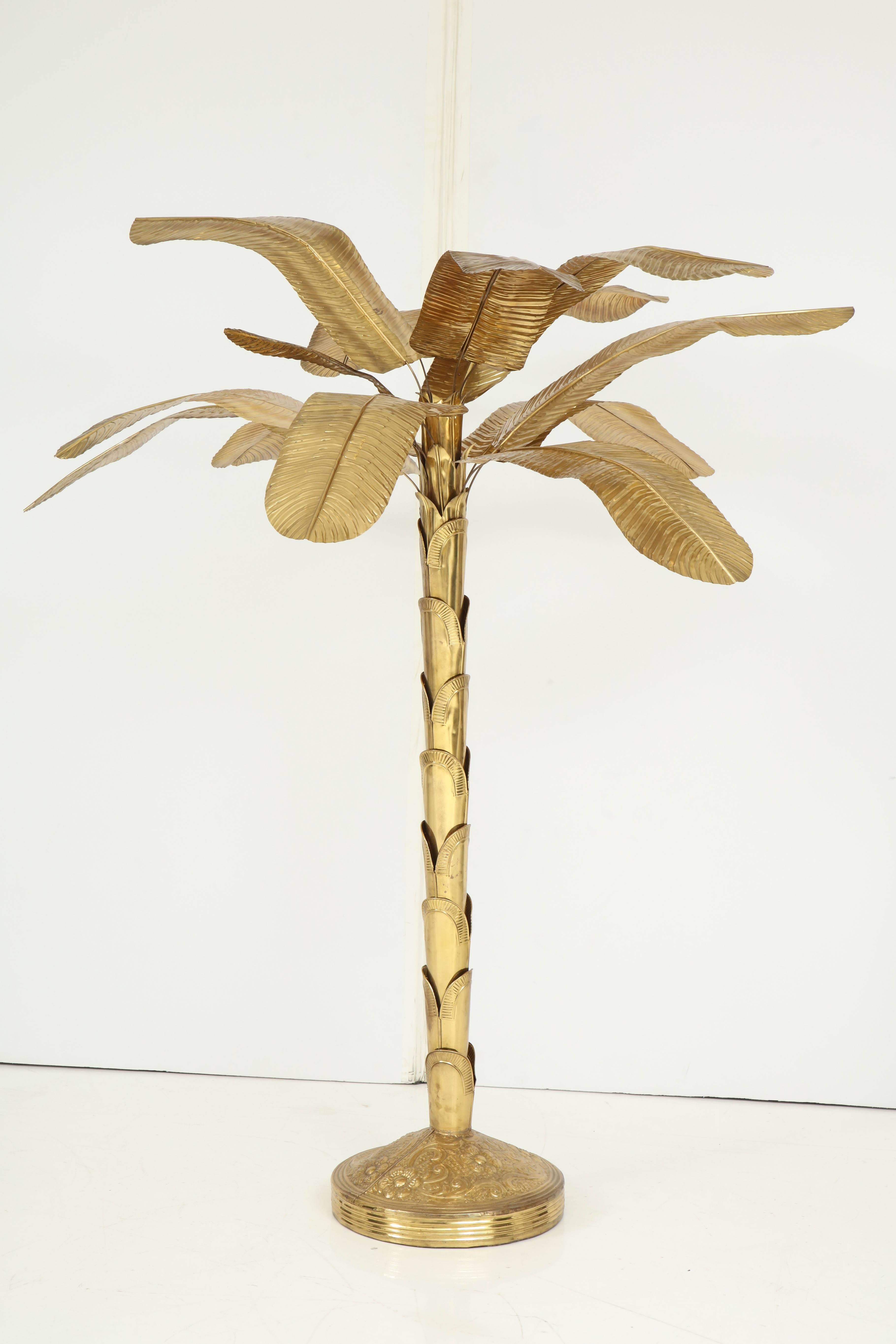 This wonderful brass banana tree adds a whimsical and bright touch to any room. A true work of art crafted to truly resemble the real thing -- minus the fruit, of course! The sculptural trunk in a round, decorated base, supports leaves with
