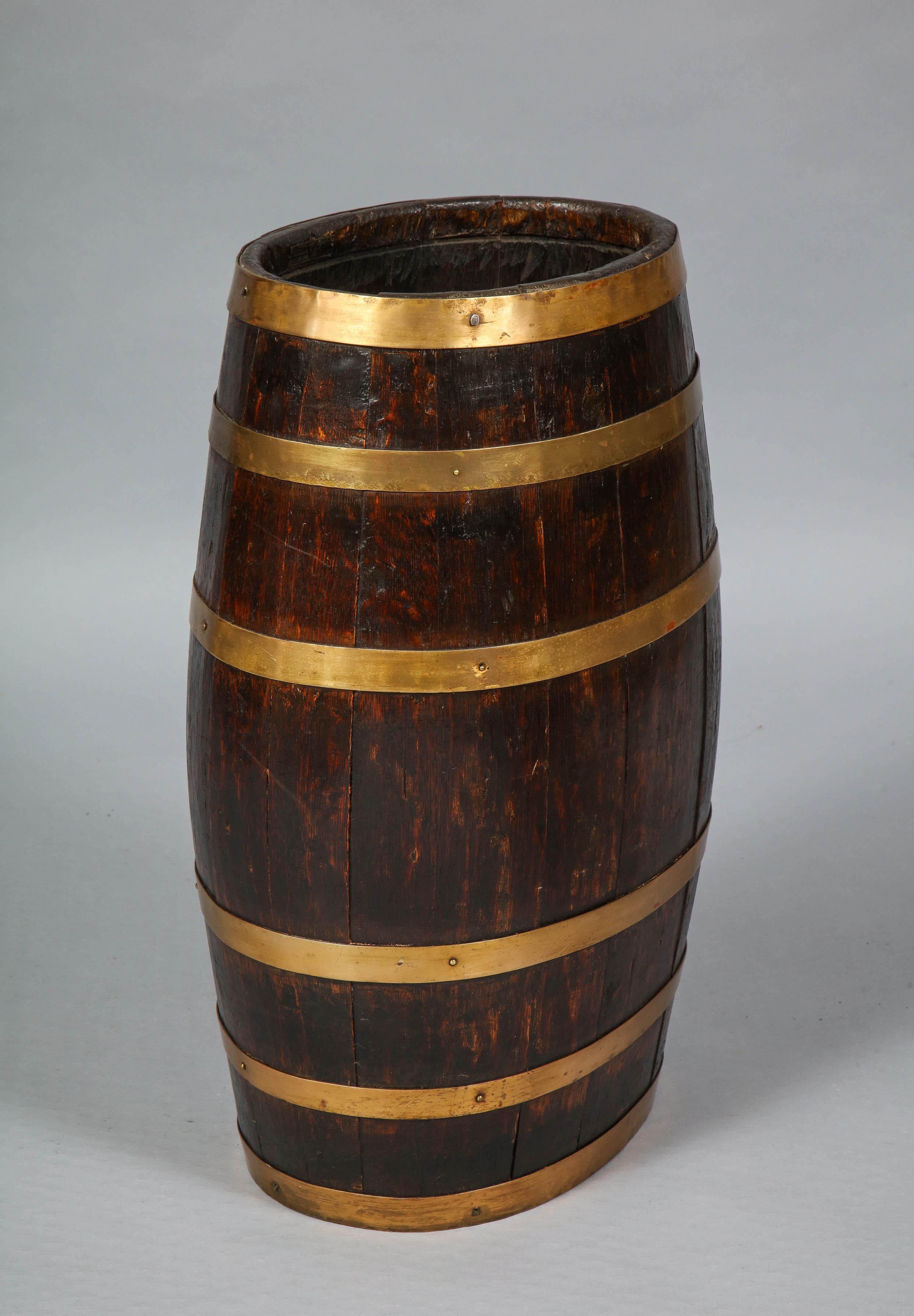 Good English 19th century barrel with original brass banding, of swelled form, the timber with good rich color and patination. Ideal umbrella or stick stand.