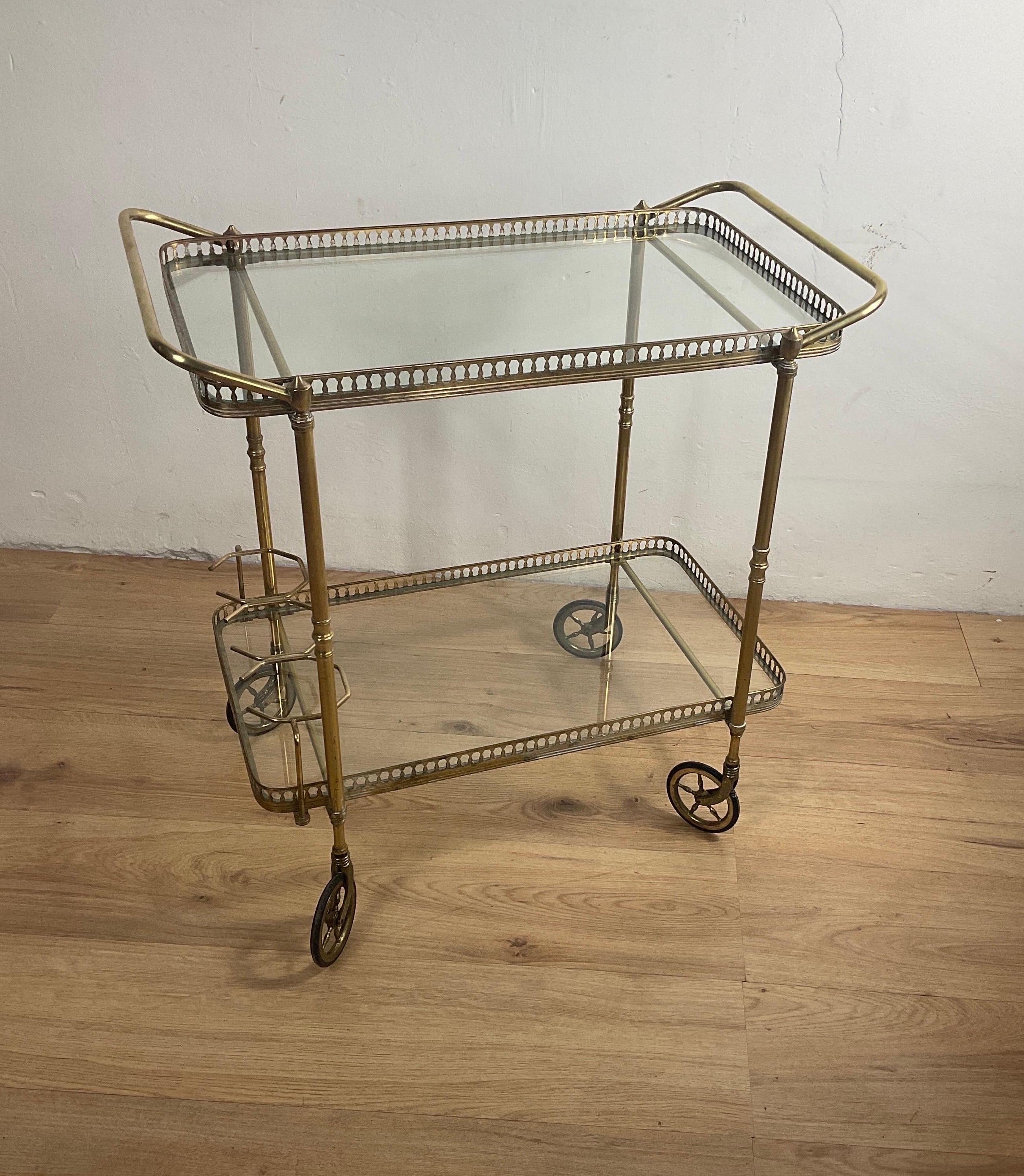 Amazing, brass bar trolly with glass surface from the 50s of the 900s attributable to Cesare Lacca. Easily manoeuvrable bar trolly, baroque and lightweight, glamorous decor.