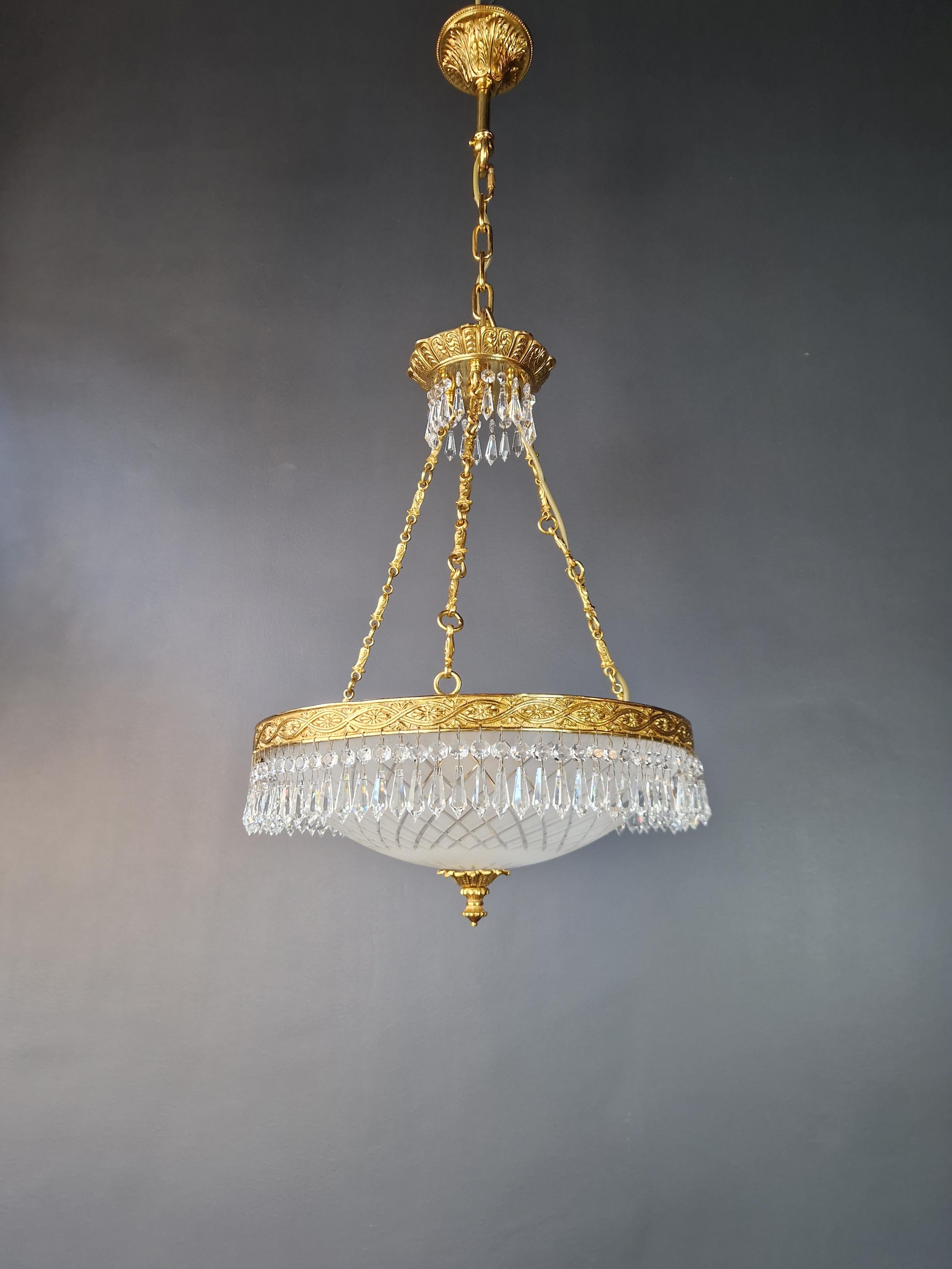 The crystals are expertly hand-knotted, adding a touch of elegance and sophistication to this timeless piece. This is a new reproduction, and several are available, ensuring you can bring this classic beauty to your space.

Measuring a total height