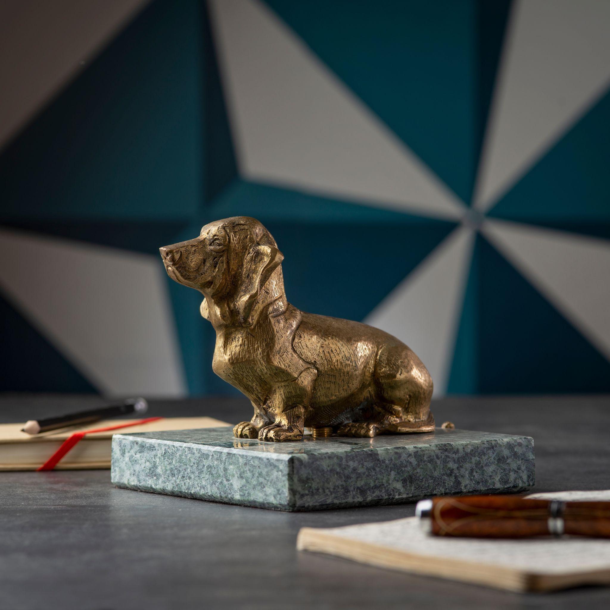 Discover our stunning brass basset with green marble base, a unique and elegant addition to any home. Expertly crafted from high-quality materials, this piece is both durable and beautiful. Its striking design and intricate details make it a