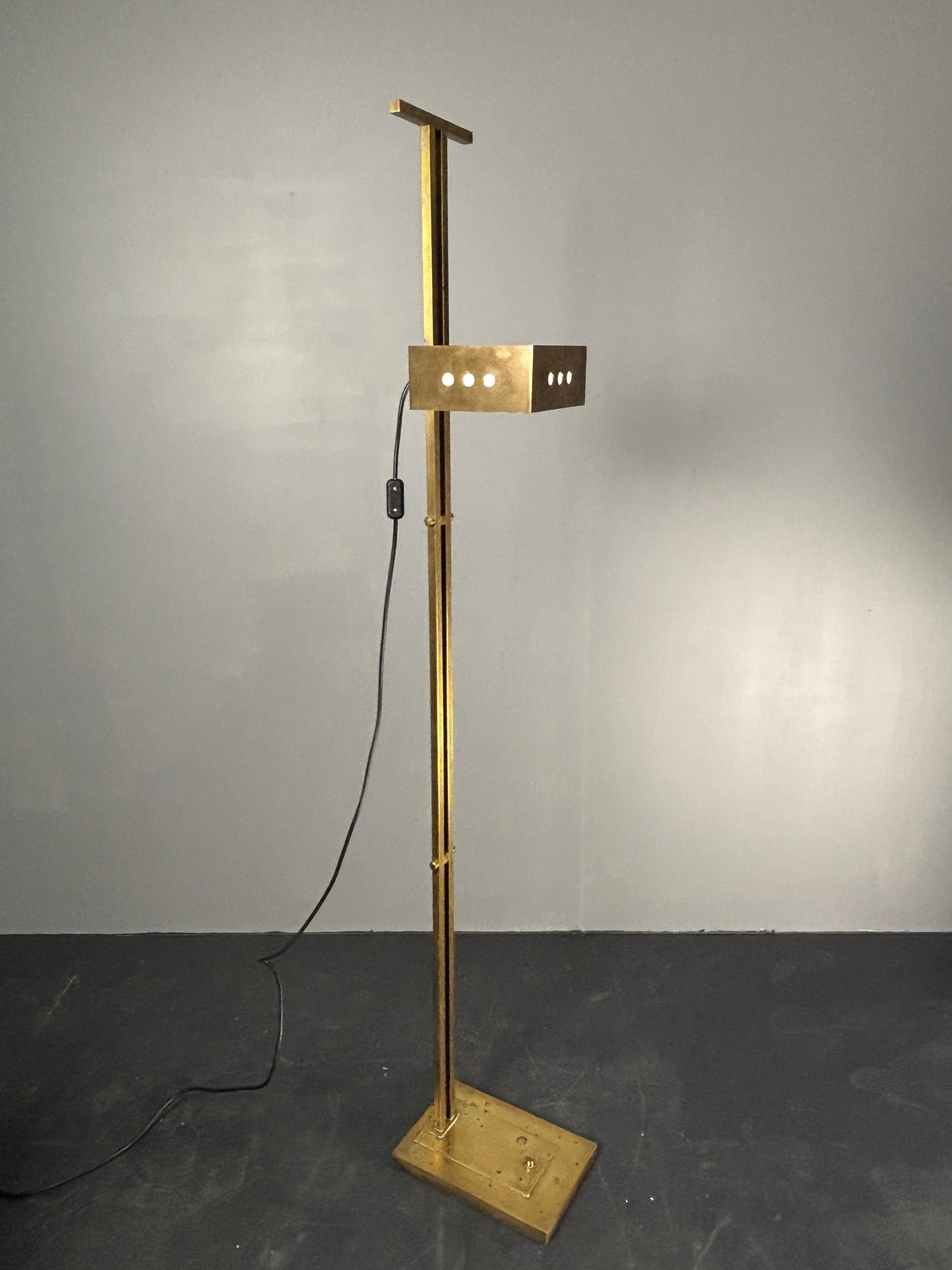 Gorgeous patinated brass Bauhaus floor lamp, design attributed to Marcel Breuer. This floor lamp is in great vintage condition, the brass especially near the foot is heavily patinated. The lamp has been rewired and refitted for a general E27