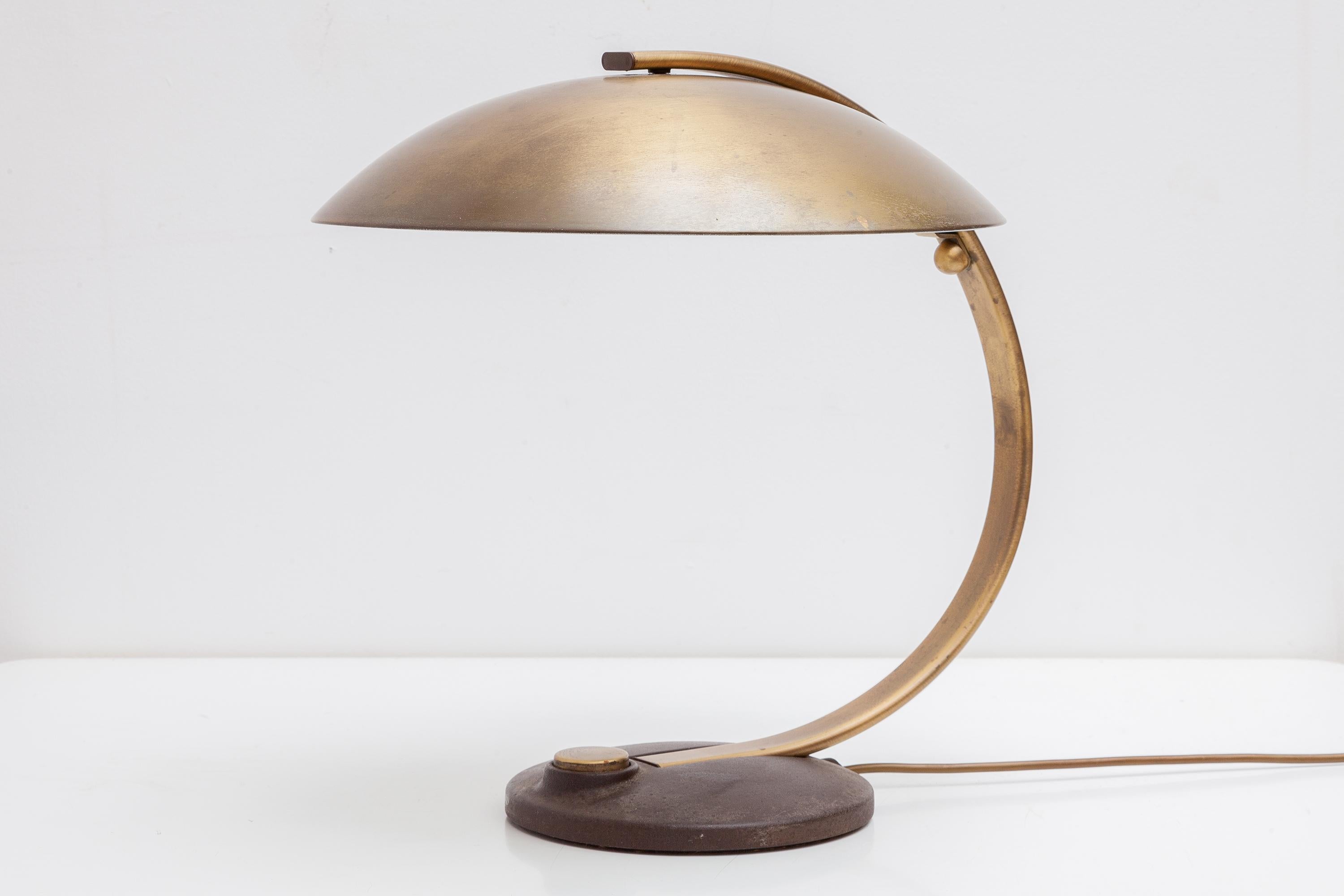 Beautiful large original Egon Hillebrand brass desk lamp, made in Germany, 1950s. Typical streamline design and heavy quality. Channel art deco vibes with this beautiful Hillebrand desk lamp in brass. Featuring an exaggerated curved arm and a round