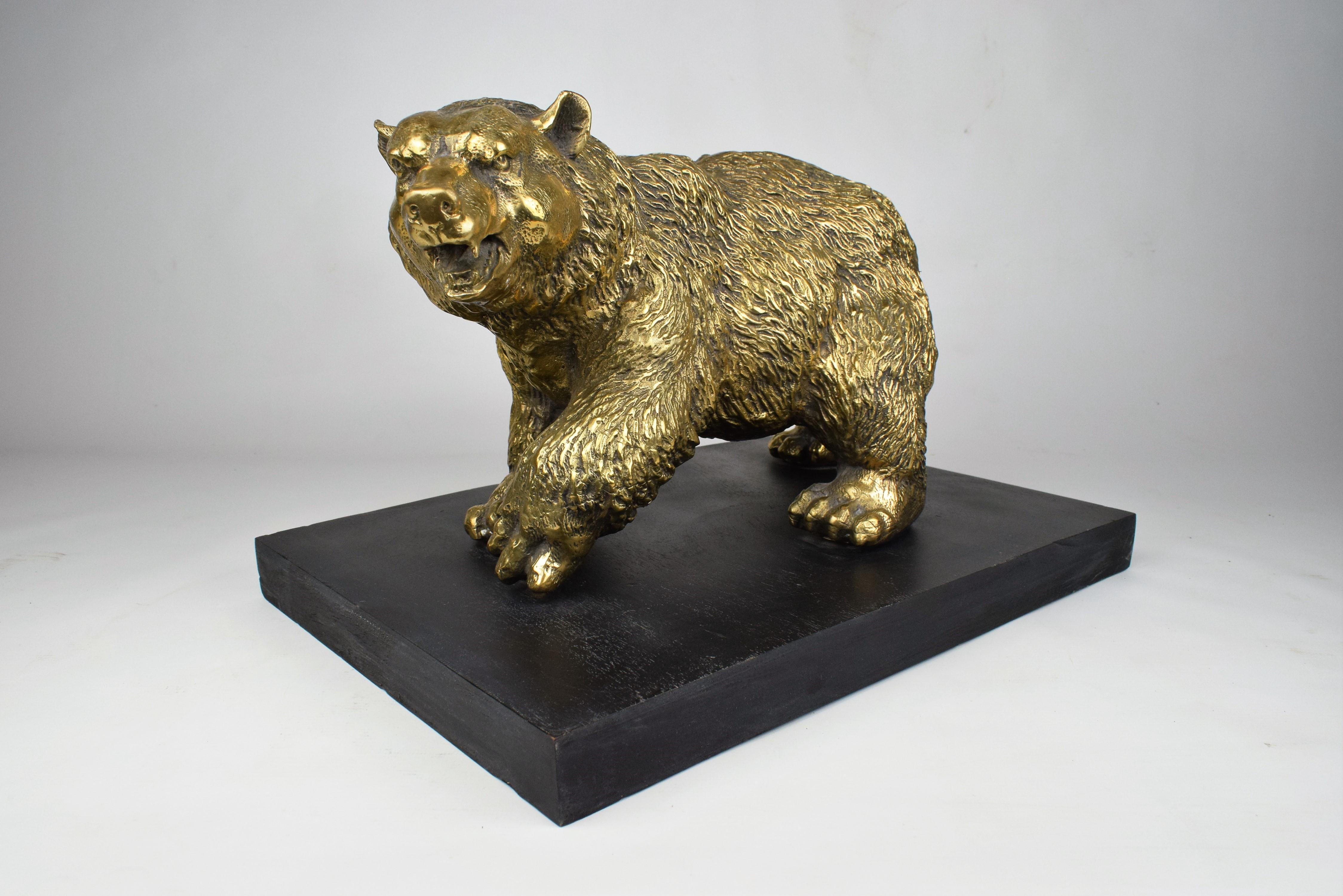 The walking brass bear sculpture is a magnificent and captivating piece of art that showcases the creativity and skill of its creator. Crafted entirely from brass, this sculpture exudes a timeless charm and elegance. Its life-like representation of