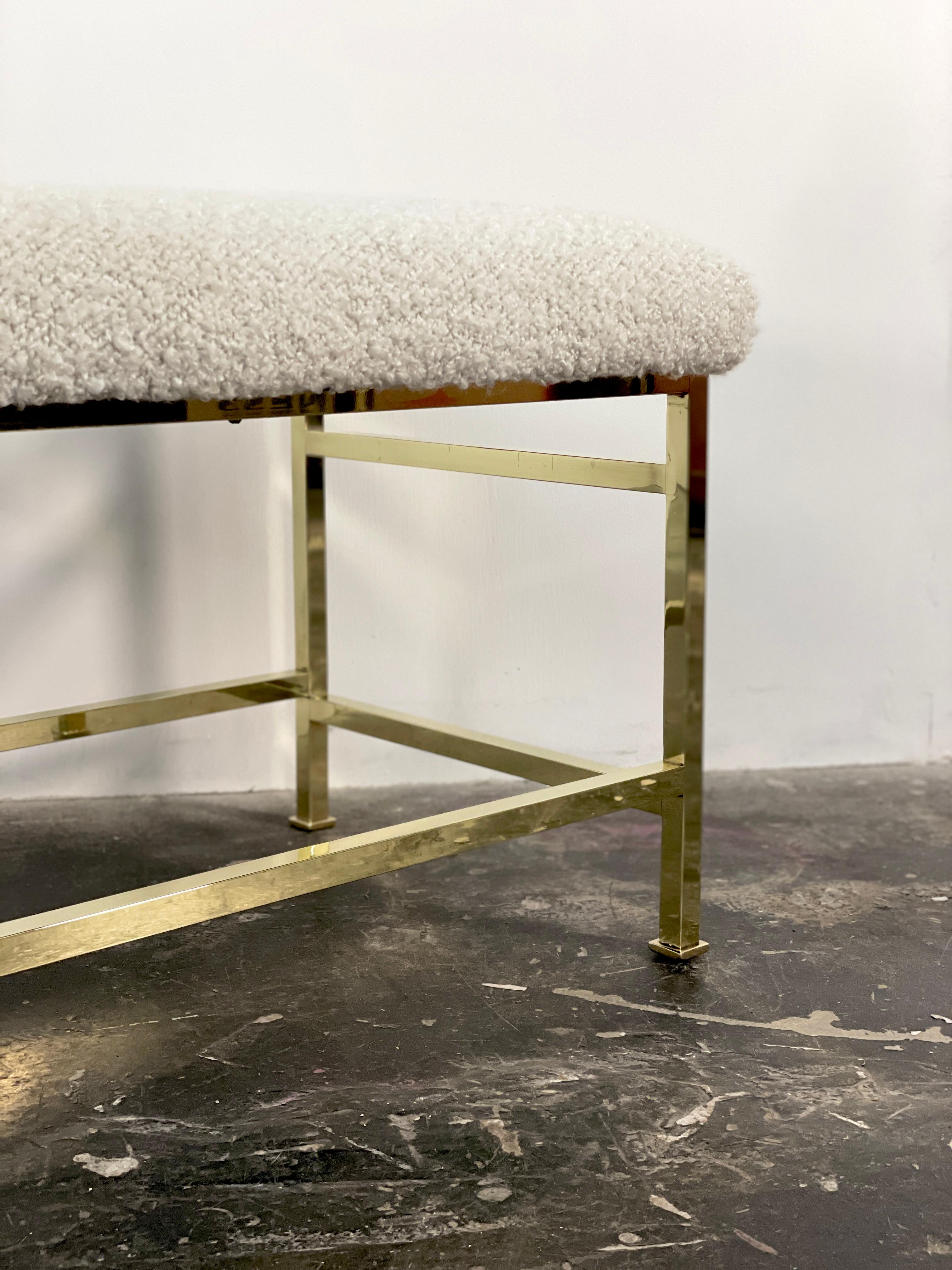 Solid Brass bench for Dunbar by Edward Wormley in new white boucle. Dunbar label affixed to bottom of the bench. This is an excellent  piece for an entry way or large bedroom. We have polished the brass to a mirror finish.

Note: we can reupholster