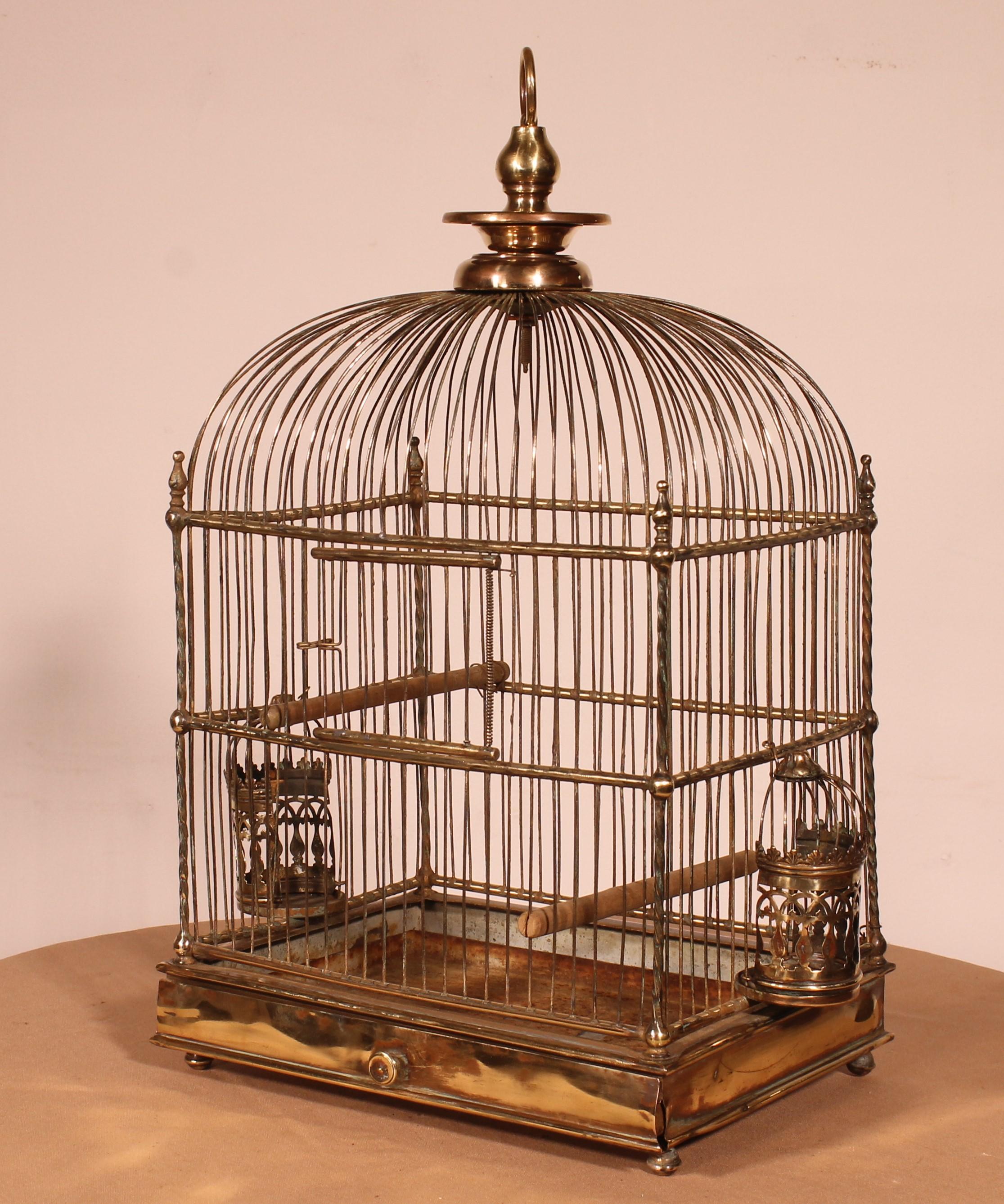 lovely 19th century brass birdcage
Beautiful small, very refined model with two brass eating containers which are very well sculpted
 The uprights are twisted which is unusual and very elegant
Beautiful patina and in very good condition
