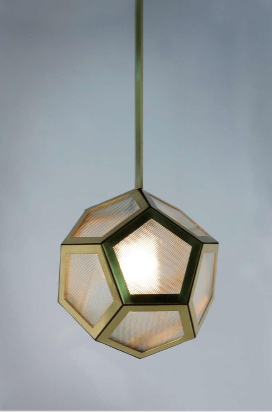 Brass, black leather and industrial glass hanging pentagon lantern. Globe is 15 in. diameter. Current total drop of the fixture is 39 in. (adjustable).